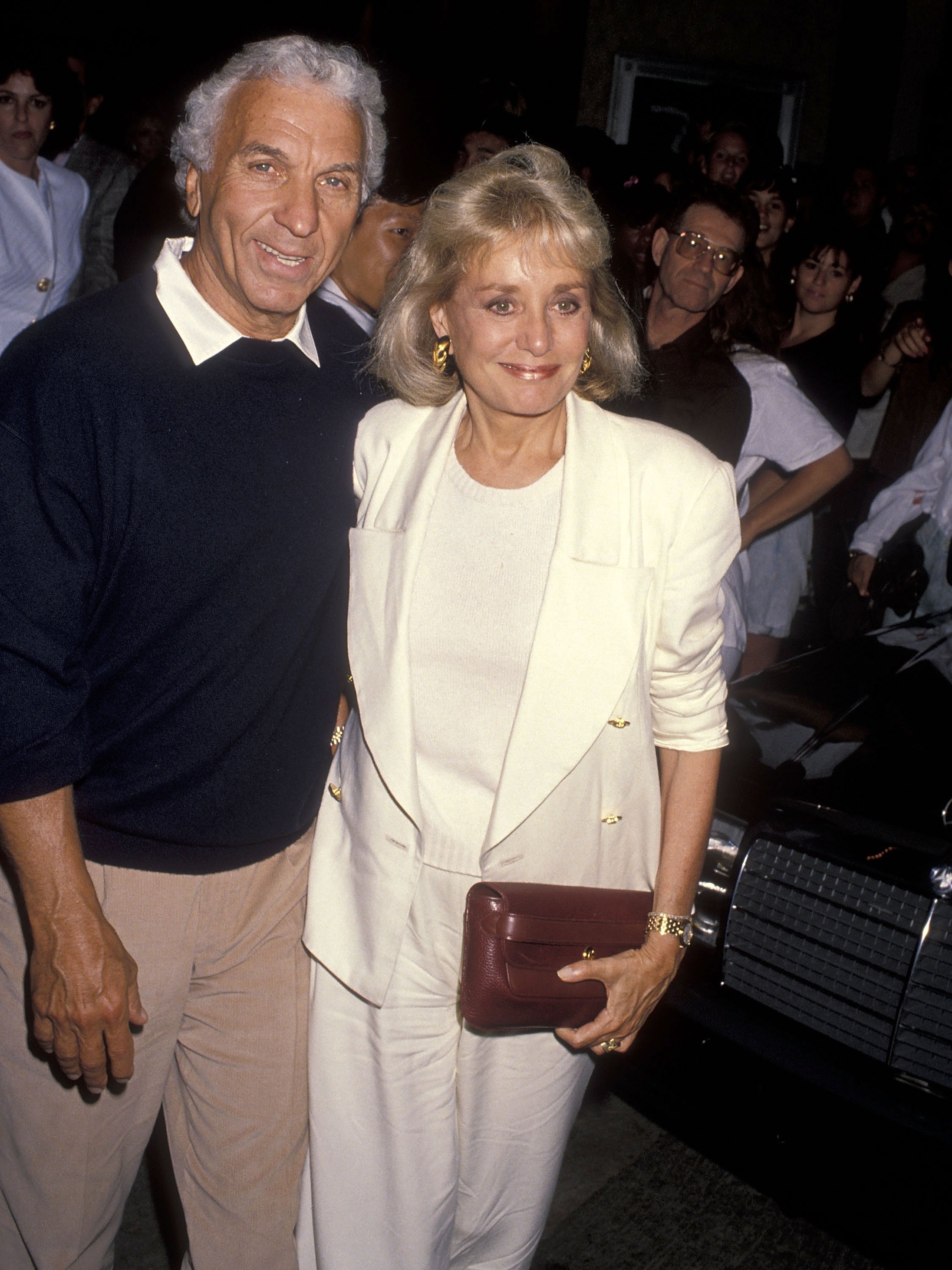 Merv Adelson and TV journalist Barbara Walters at the "Presumed Innocent" Westwood Premiere on July 25, 1990 at the Mann Bruin Theatre in Westwood, California. | Source: Getty Images