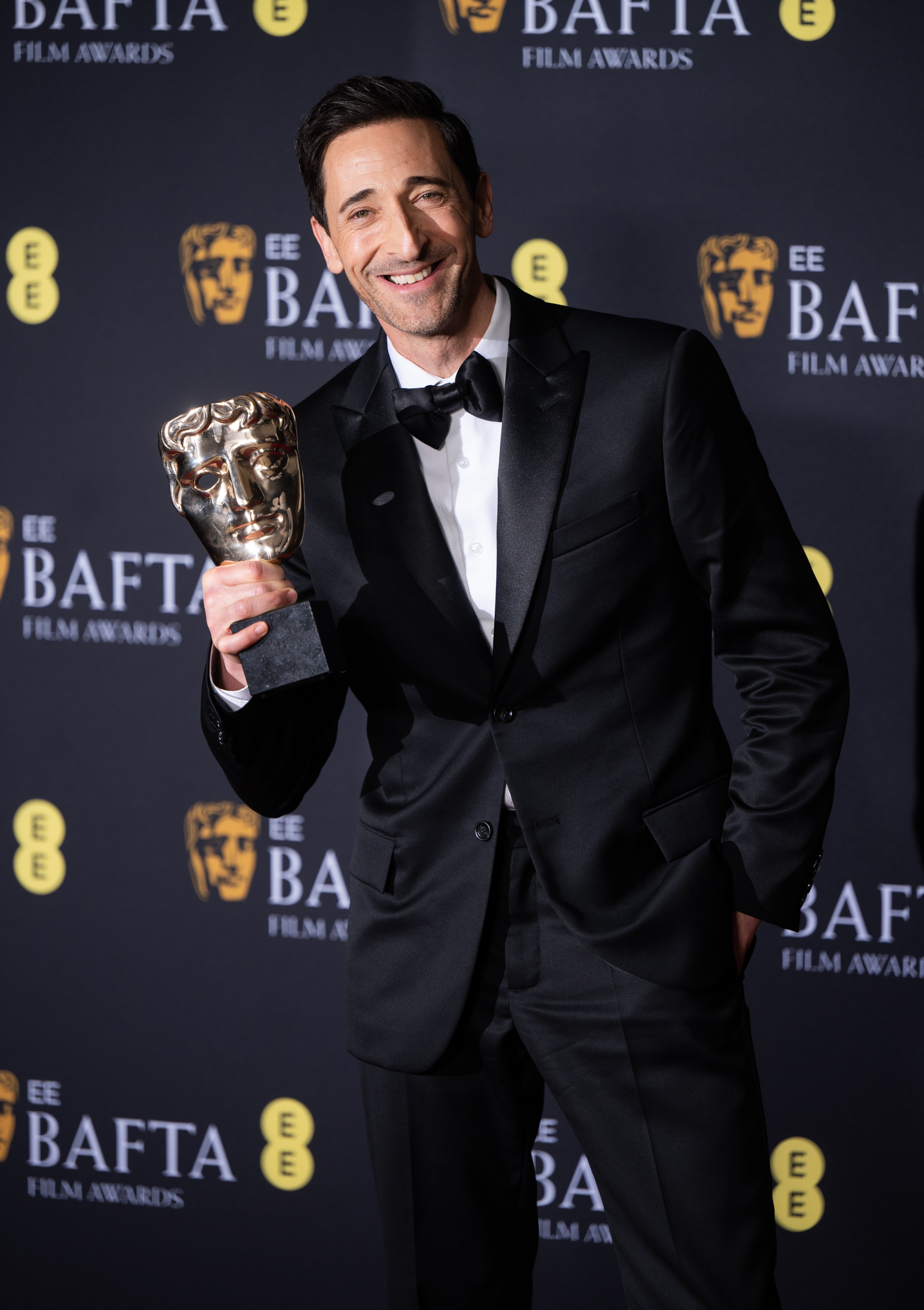 Adrien Brody poses in the winners room on February 16, 2025 | Source: Getty Images