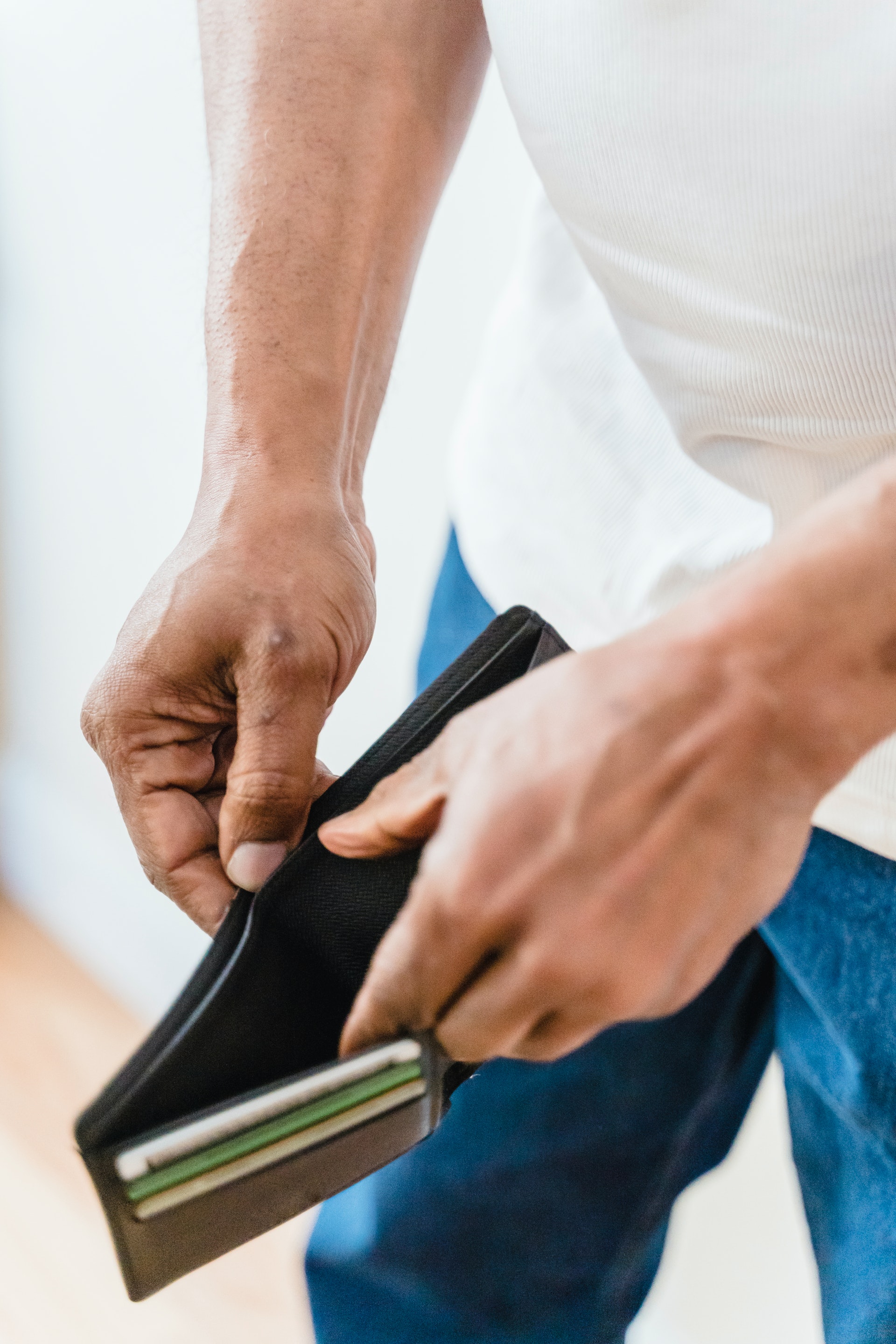 Close-up of a man with an empty wallet | Source: Pexels