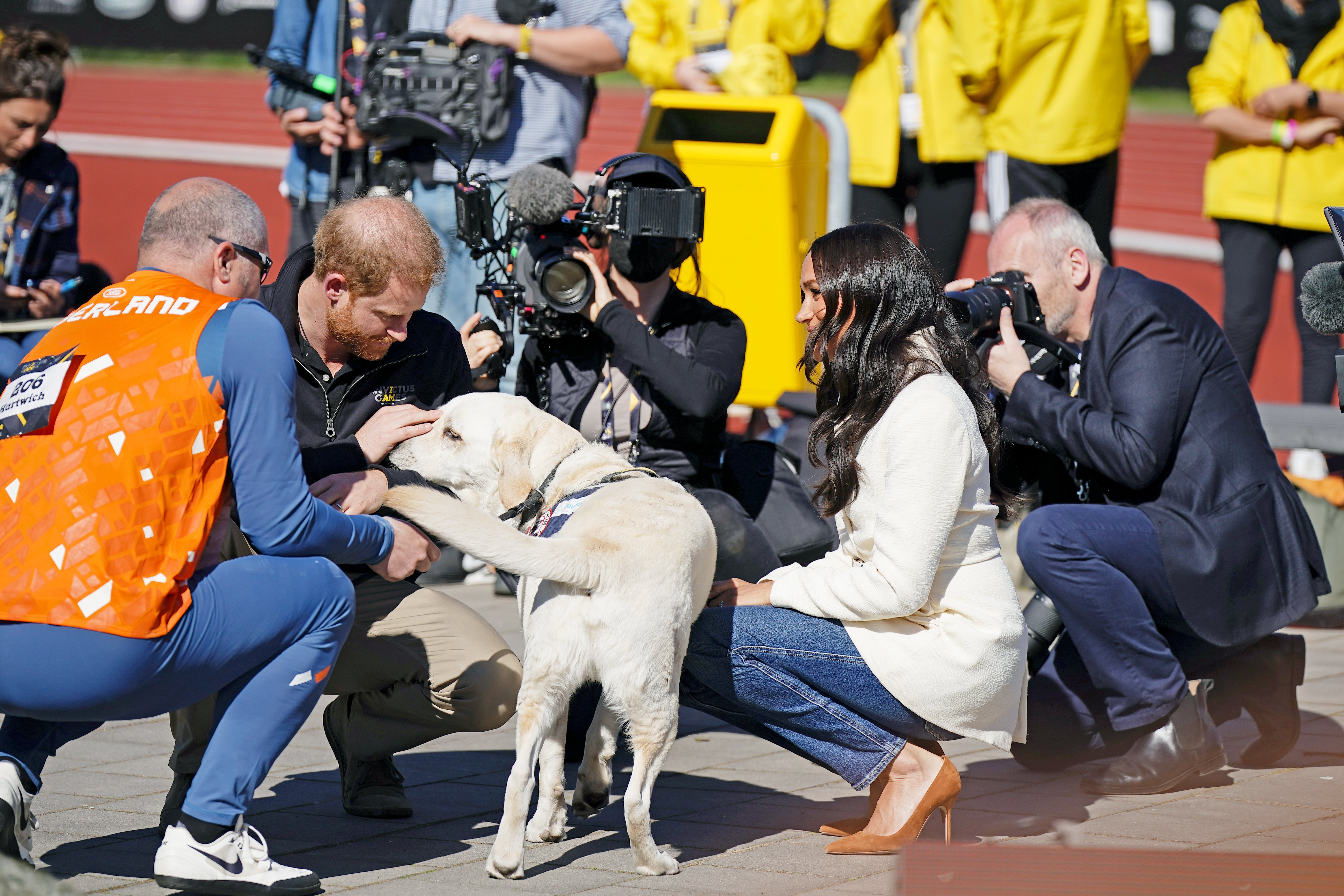 The Duke and Duchess of Sussex meet a competitor from the Netherlands and his dog at the Invictus Games athletics events in the Athletics Park, at Zuiderpark the Hague, Netherlands. Picture date: Sunday April 17, 2022. | Source: Getty Images