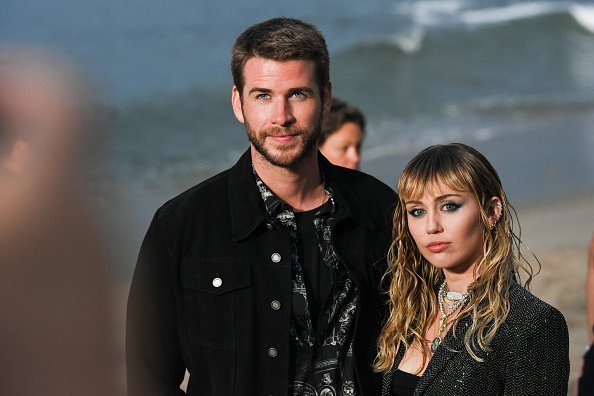 Liam Hemsworth and Miley Cyrus at Saint Laurent mens spring summer 20 show on June 06, 2019 | Photo: Getty Images