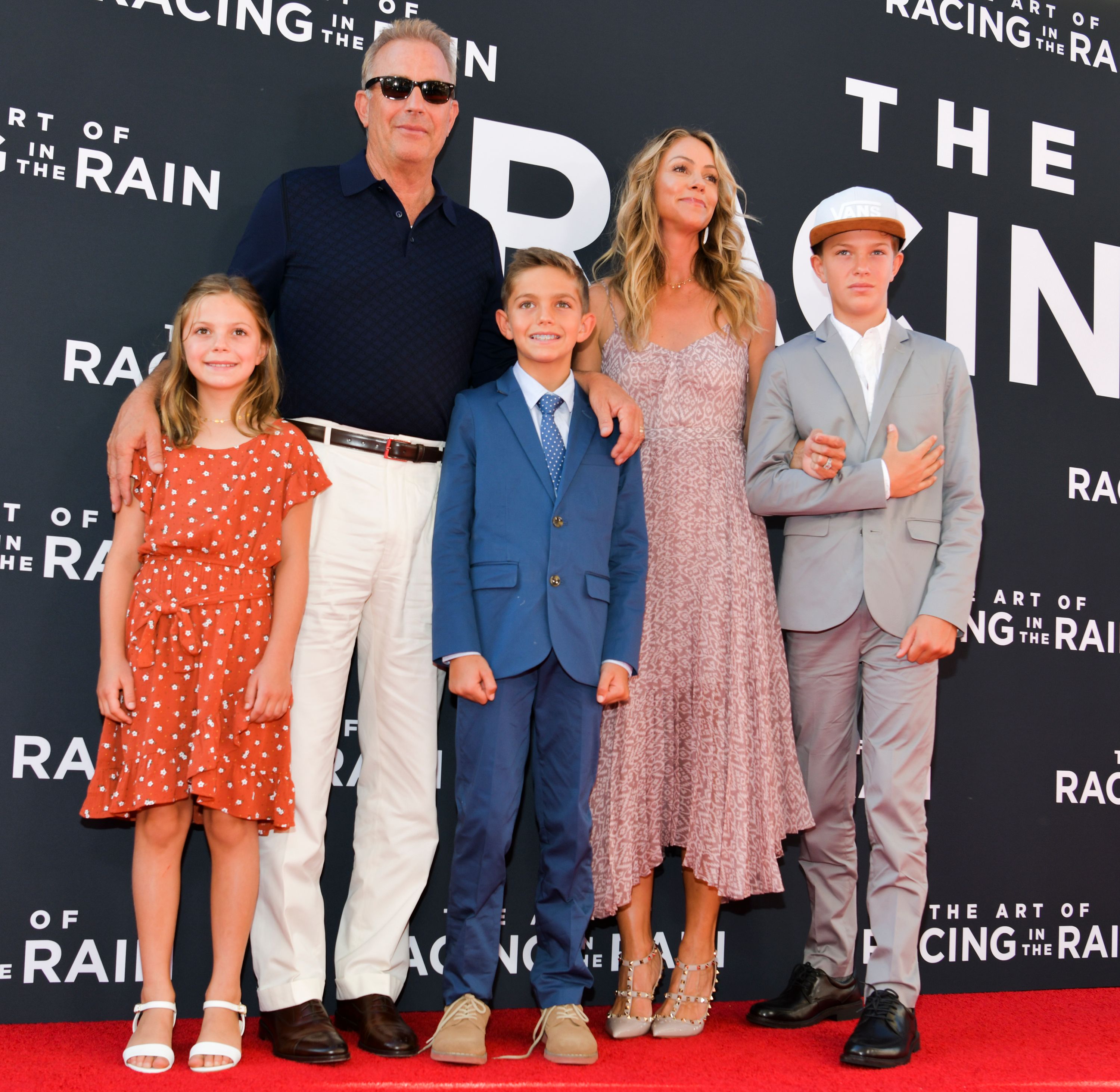 Grace Avery Costner, Kevin Costner, Hayes Logan Costner, Christine Baumgartner, and Cayden Wyatt Costner during the premiere of 20th Century Fox's "The Art of Racing in the Rain" at El Capitan Theatre on August 01, 2019, in Los Angeles, California. | Source: Getty Images