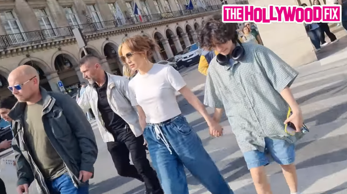 Jennifer Lopez and Emme Muñiz walk with security in Paris, France, as seen in a video dated May 12, 2024. | Source: YouTube/TheHollywoodFix