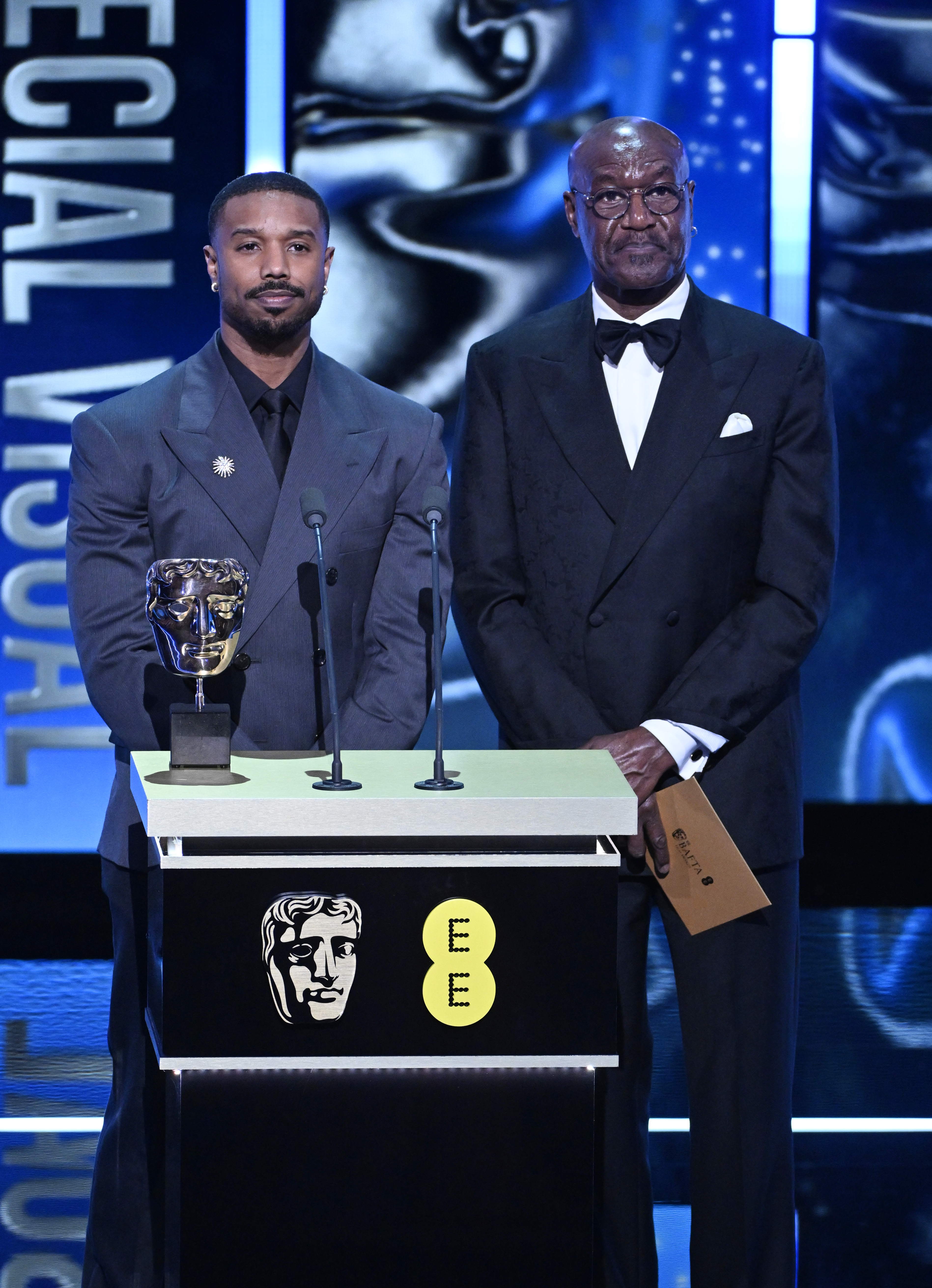 Michael B. Jordan and Delroy Lindo presenting the Special Visual Effects Award on stage during the EE BAFTA Awards at The Royal Festival Hall on February 22, 2026, in London, England. | Source: Getty Images