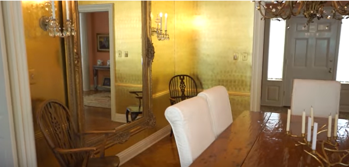 A wooden table and antique mirror in Donna Mills' house | Source: Source: YouTube/@LosAngelesTimes