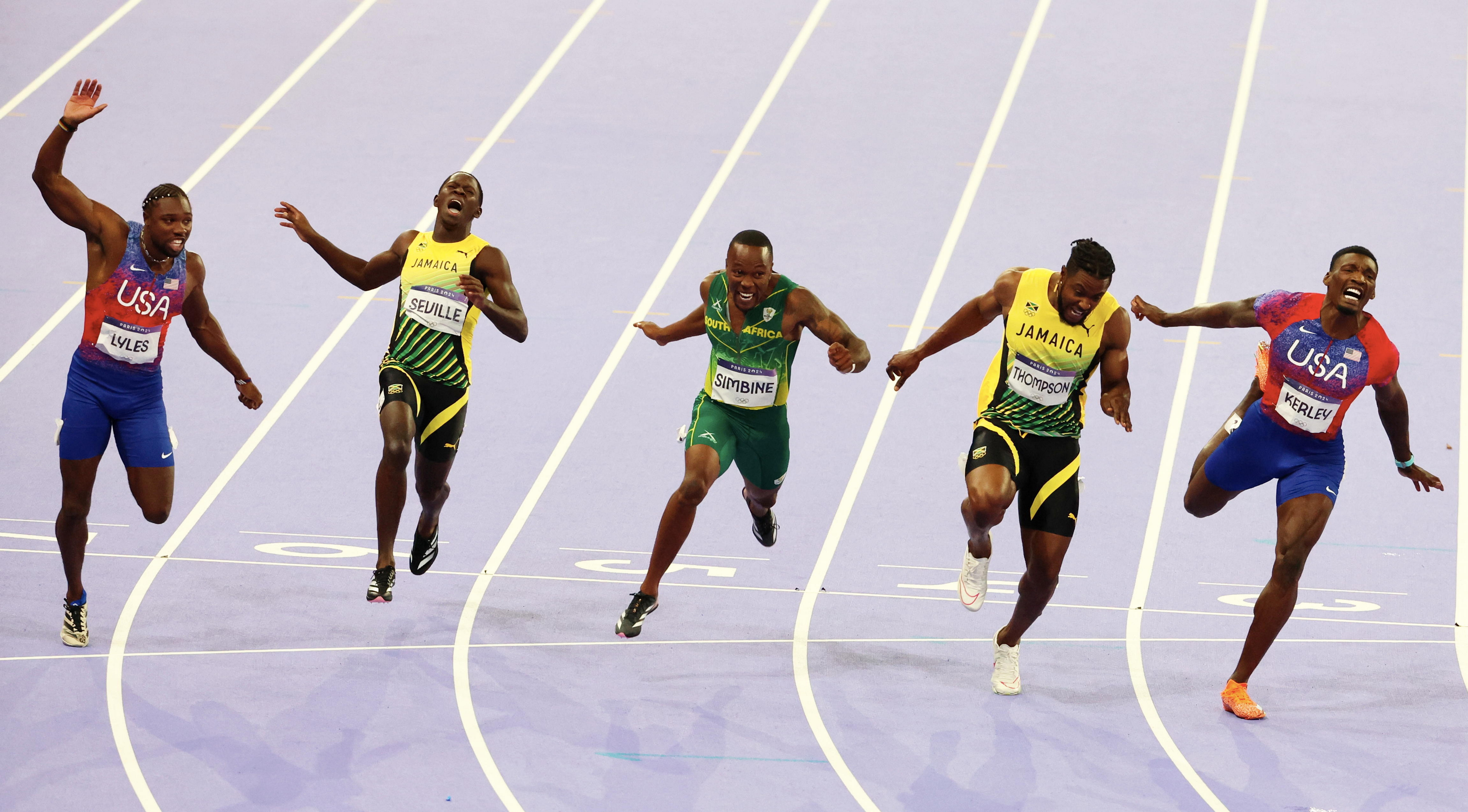 Noah Lyles, Oblique Seville, Akani Simbine, and Kishane Thompson cross the finish line during the men's 100m final at the 2024 Paris Summer Olympic Games in Paris, France, on August 4, 2024. | Source: Getty Images