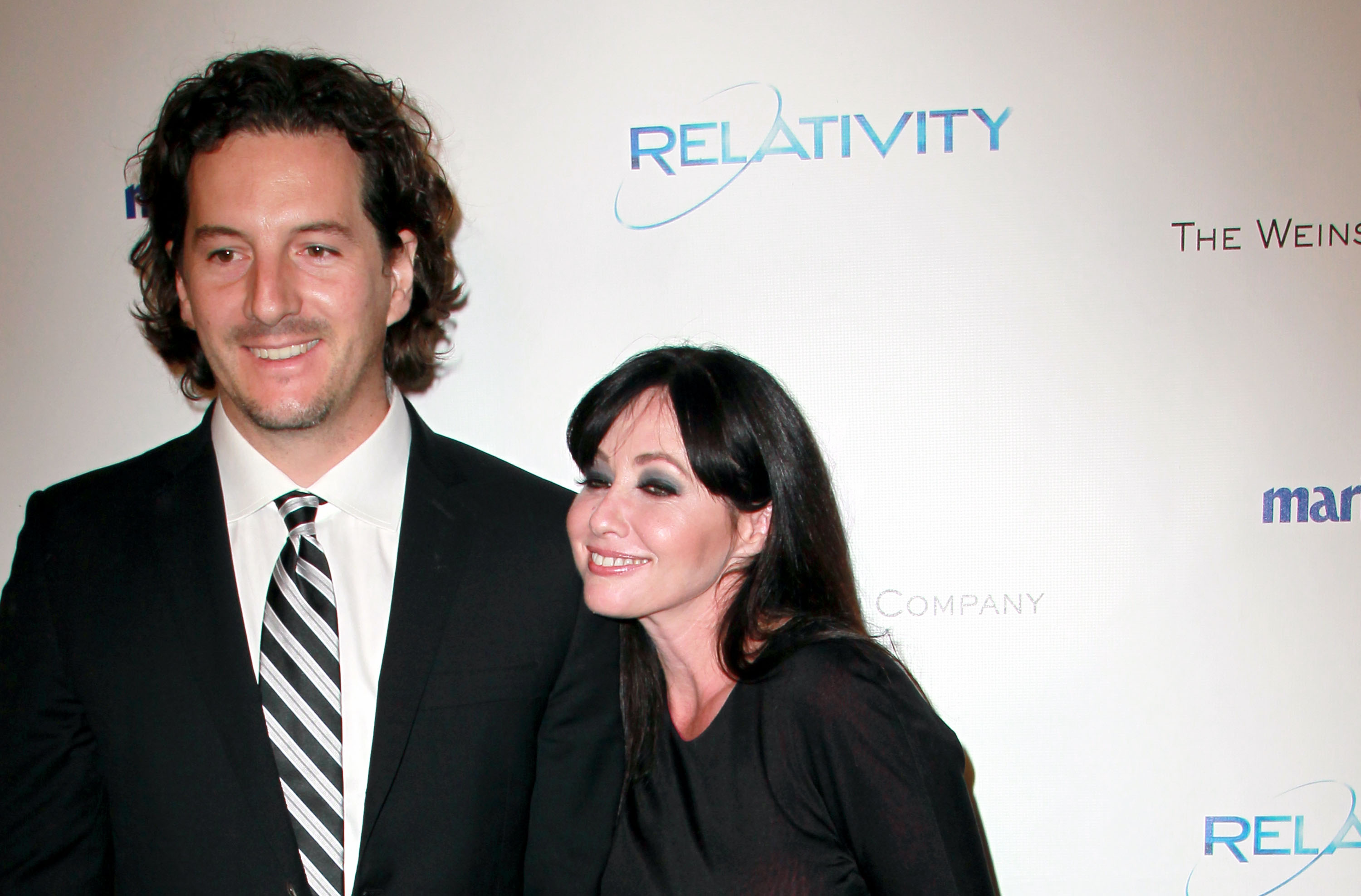 Shannon Doherty and her husband photographer Kurt Iswarienko arrive at The Weinstein Company And Relativity Media's 2011 Golden Globe Awards Party at The Beverly Hilton hotel on January 16, 2011 in Beverly Hills, California | Source: Getty Images