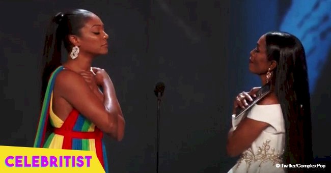 Angela Bassett rocks architectural white gown, gives 'Wakanda Forever' salute with Tiffany Haddish 