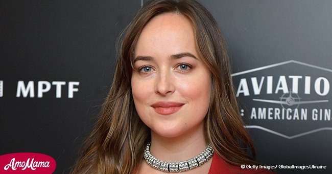 Dakota Johnson shares kiss with a mystery man while running errands without her beau Chris Martin