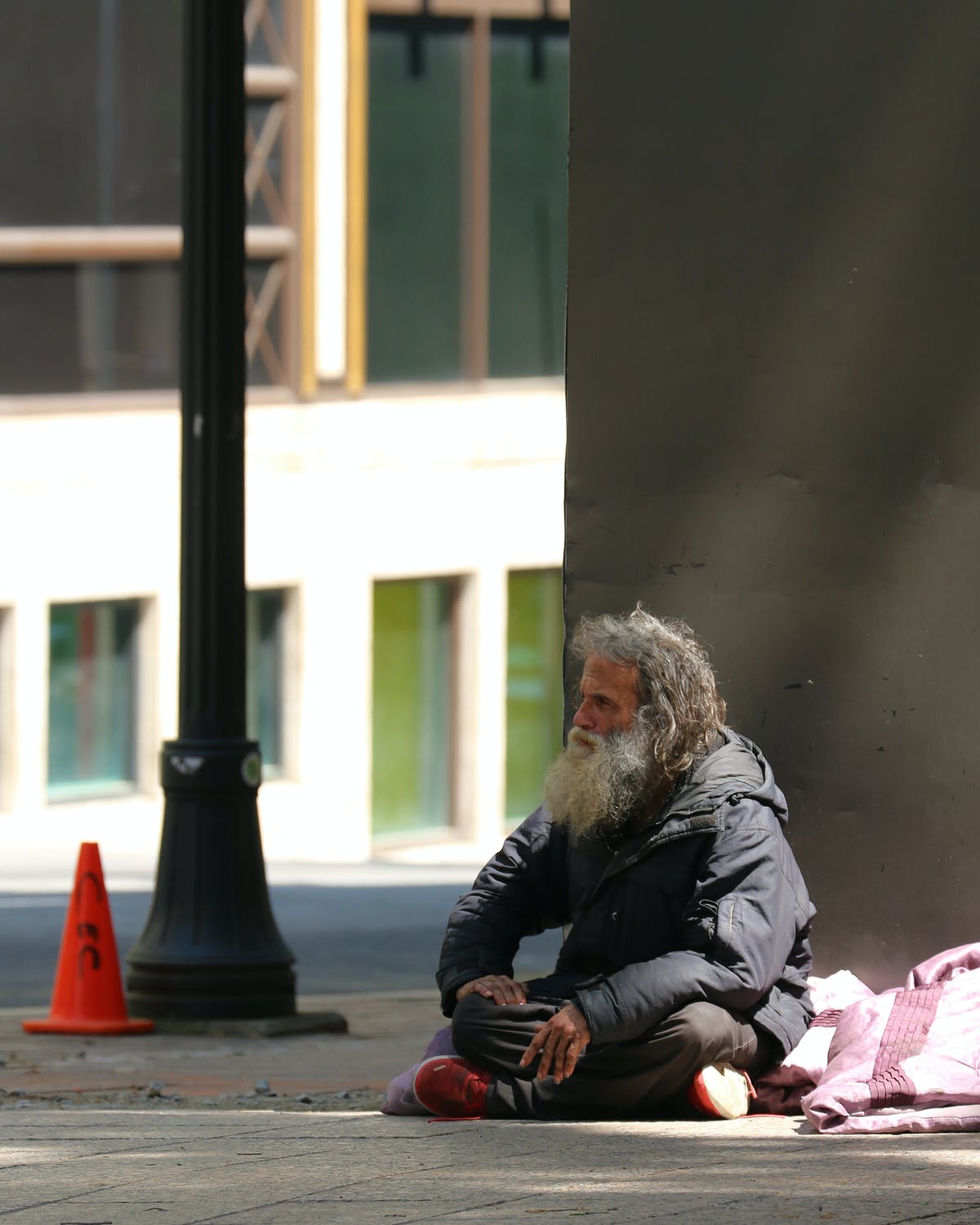A homeless man had taken up residence by the side of the main door | Source: Pexels