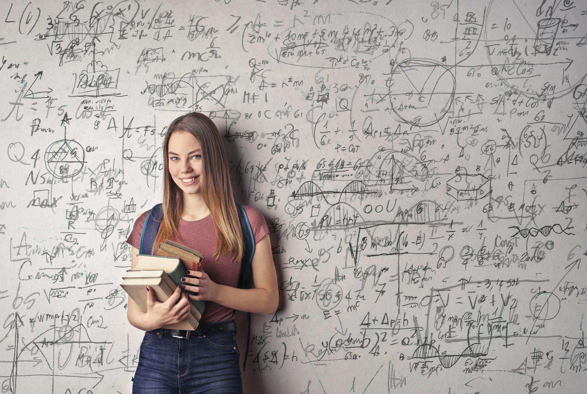 A college student standing in a classroom | Source: Pexels