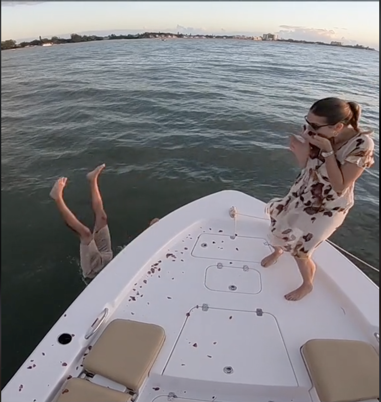 Scott Clyne falls into the water to retrieve the ring box | Source: TikTok/humankind