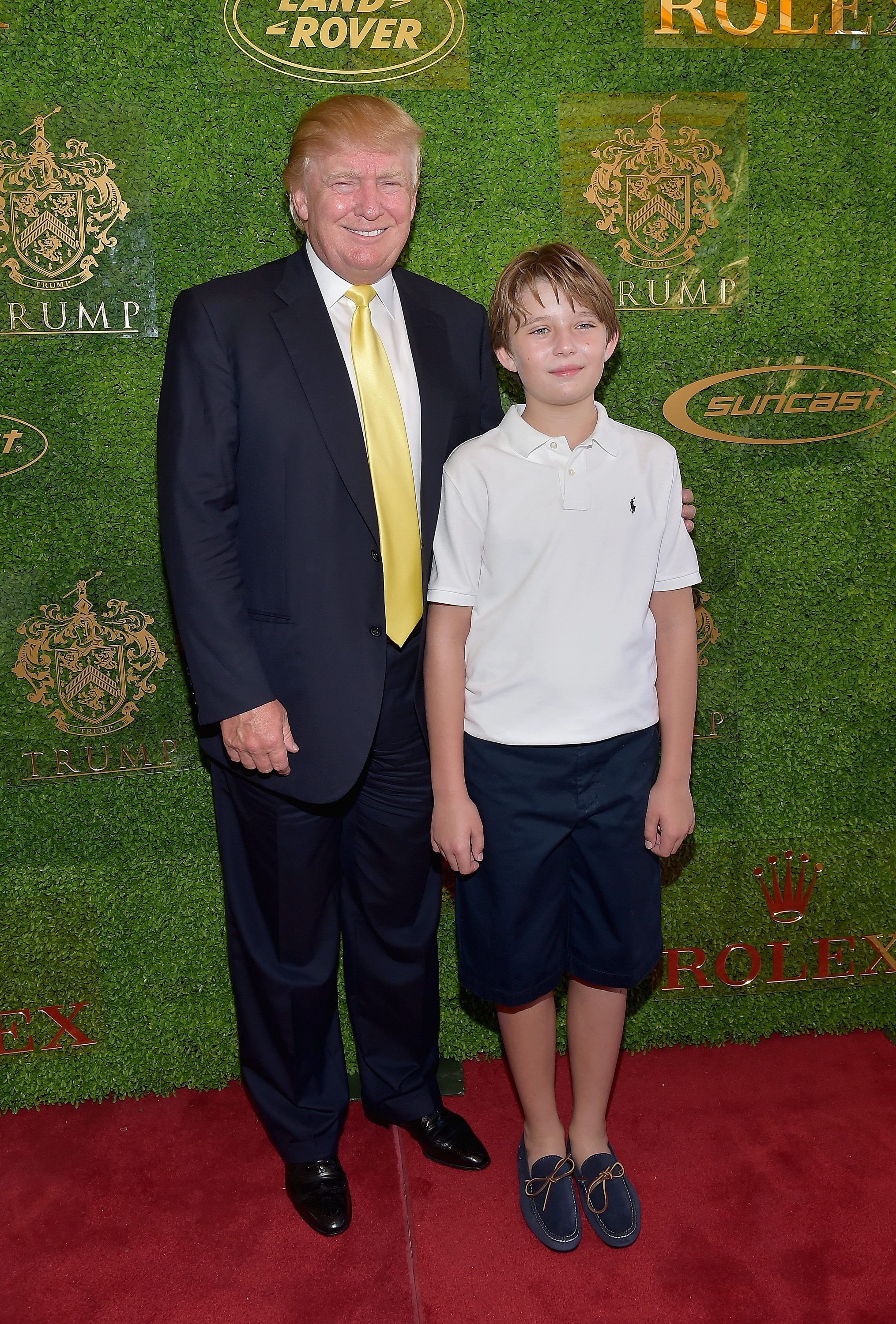 Donald and Barron Trump at the Trump Invitational Grand Prix at The Mar-a-Lago Club on January 4, 2015, in Palm Beach, Florida. | Source: Getty Images