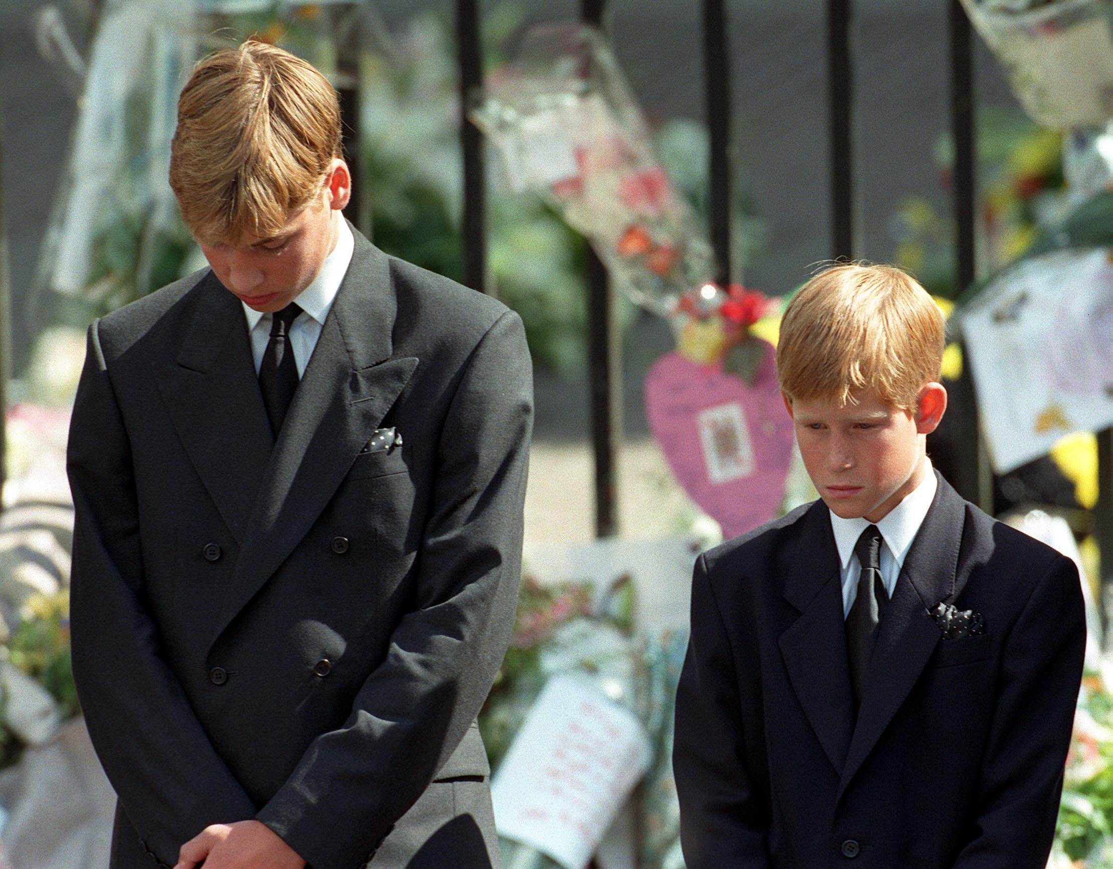 Prince William and Prince Harry stand outside Westminster Abbey at the funeral of Diana, Princess of Wales on September 6, 1997, in London, England.  | Source: Getty Images