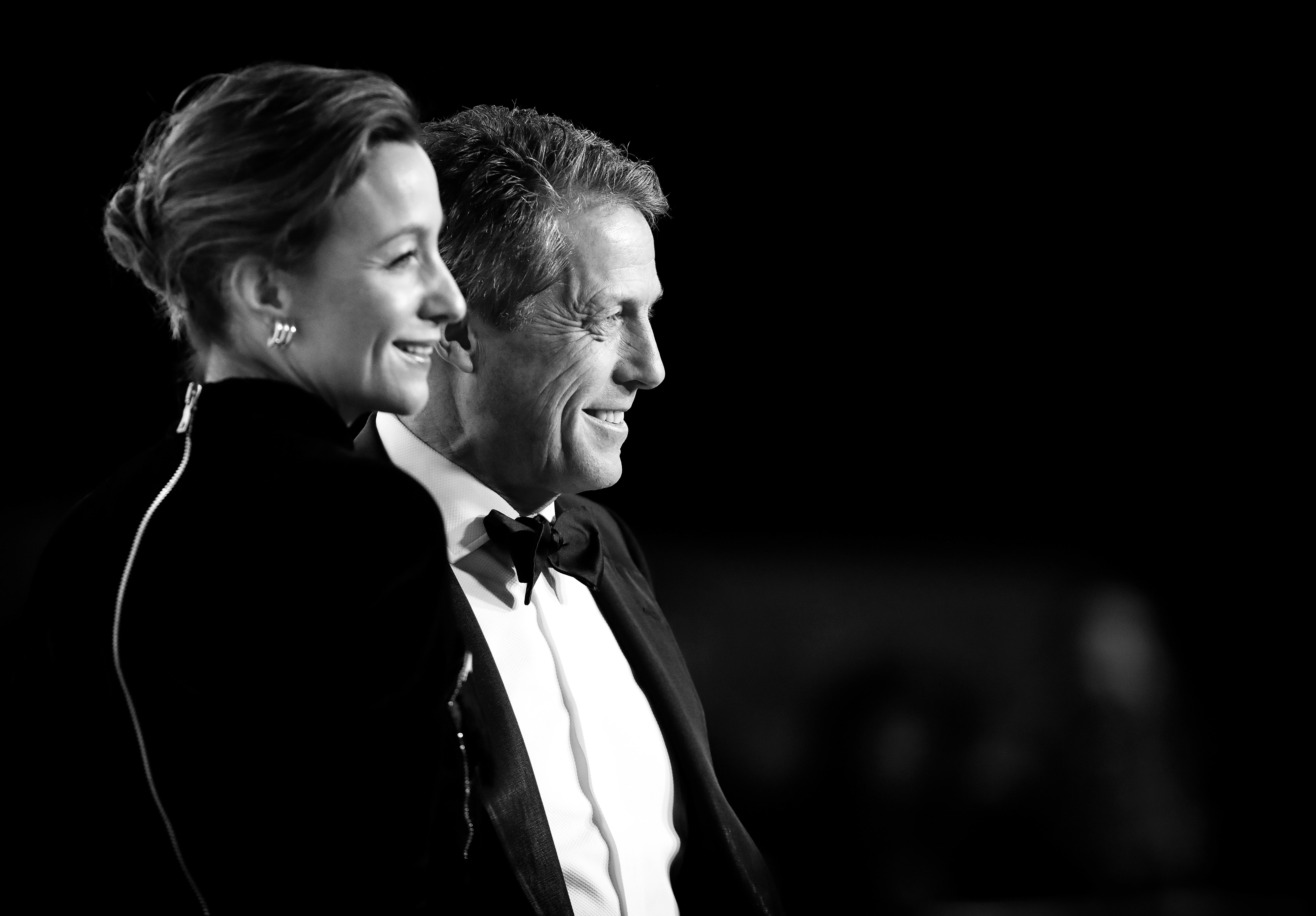 Anna Elisabet Eberstein and Hugh Grant attend the EE British Academy Film Awards 2020 at the Royal Albert Hall on February 2, 2020 in London, England. | Source: Getty Images 