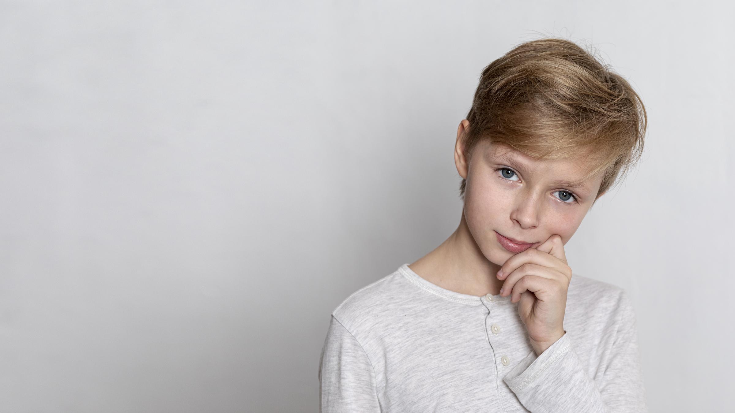 A thoughtful boy | Source: Freepik