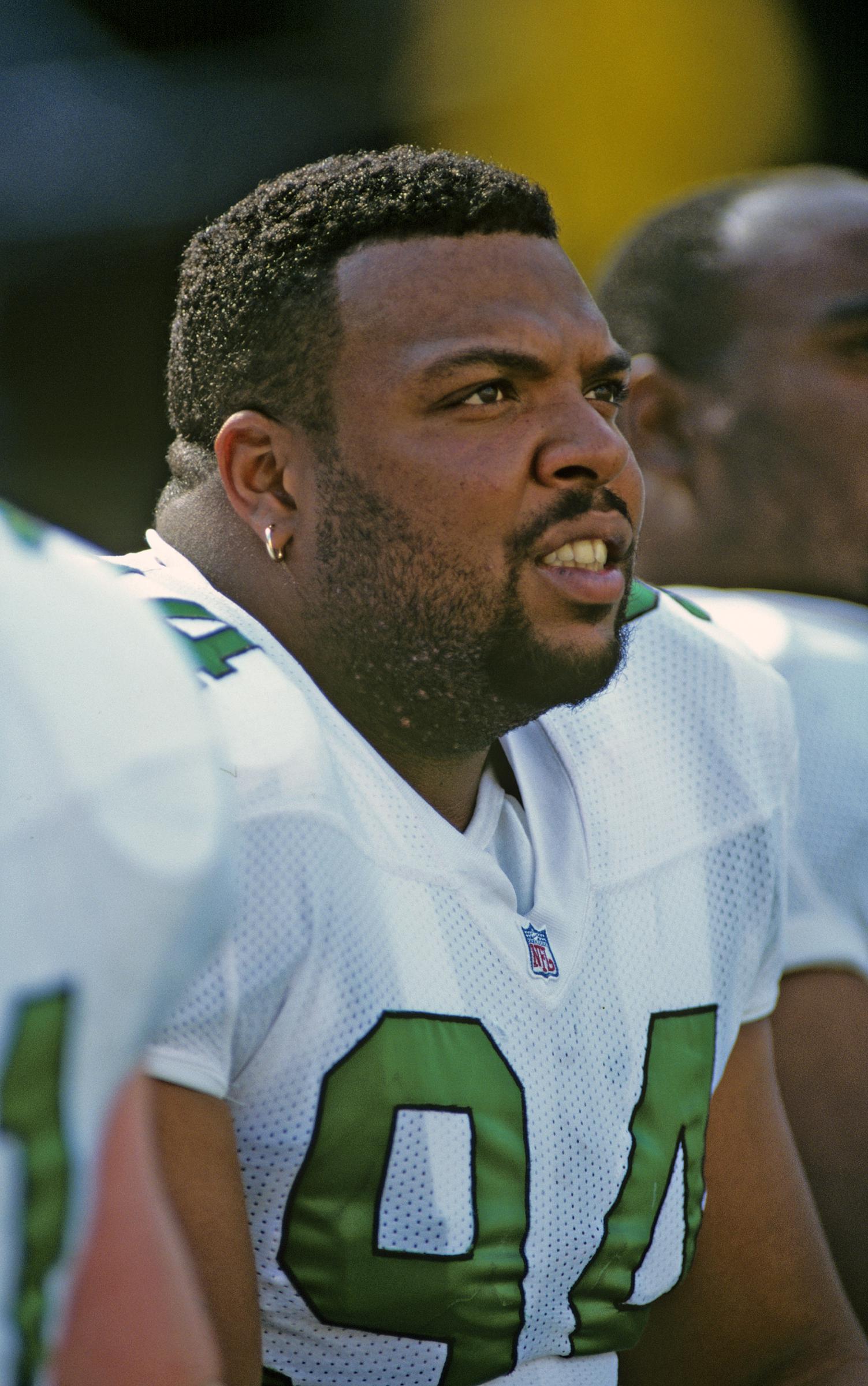 Defensive lineman Kevin Johnson of the Philadelphia Eagles looks on from the sideline during a game against the Washington Redskins at Veterans Stadium in Philadelphia, Pennsylvania on October 8, 1995. | Source: Getty Images