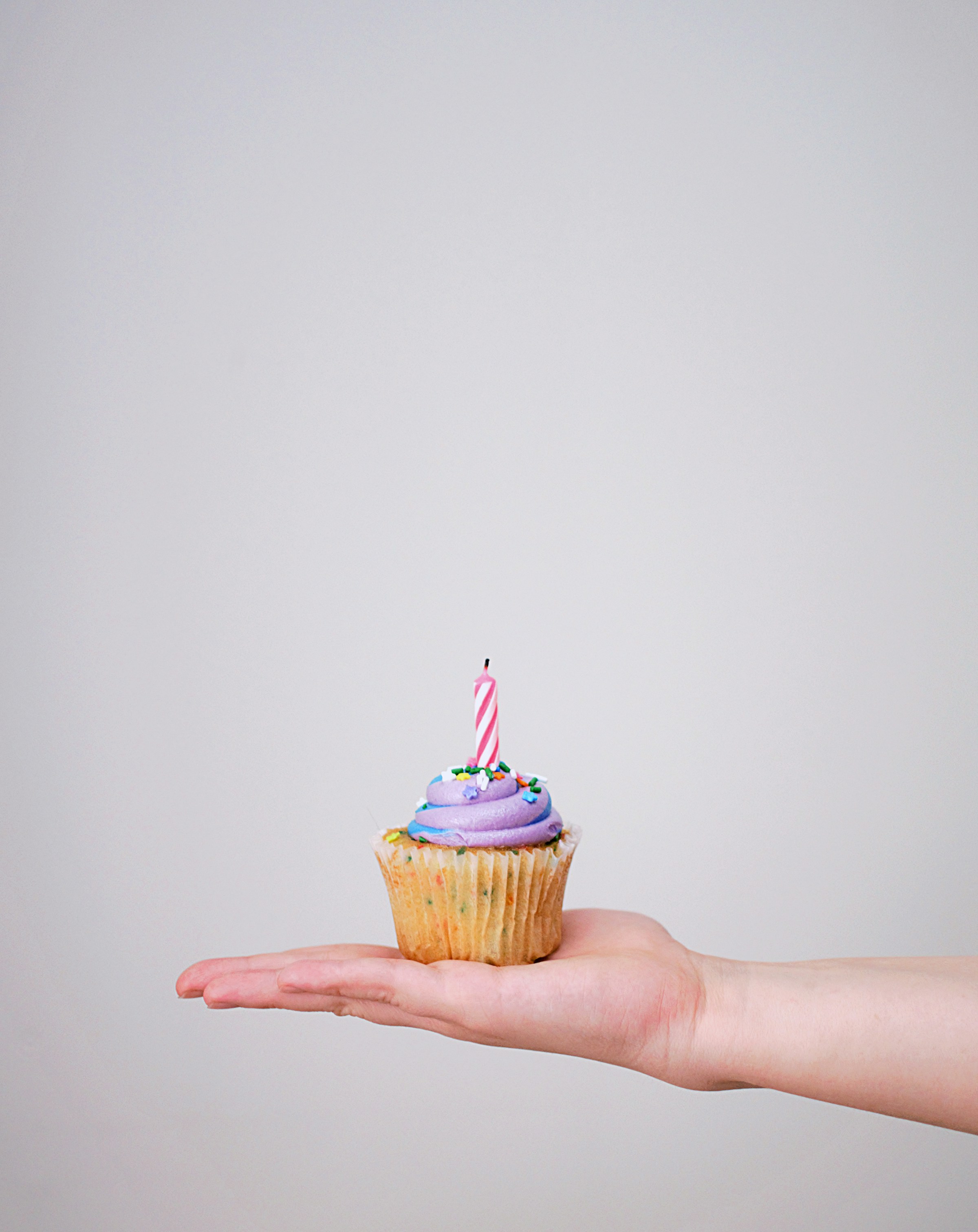 Cupcake with a candle | Source: Unsplash