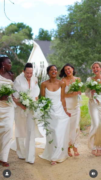 Britt Stewart sharing a moment with her bridal party, including maid of honor Hayley Erbert. | Source: Instagram/samkoma.world and maksmaakphoto