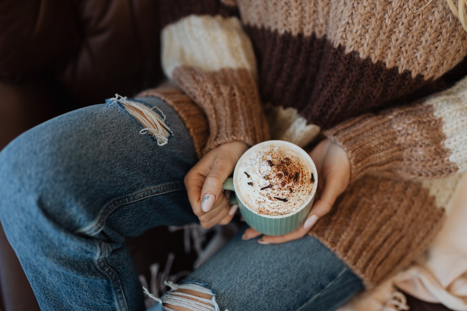 Person holding a mug of hot chocolate | Source: Pexels