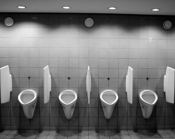 Black and white gents toilets. | Photo: Getty Images