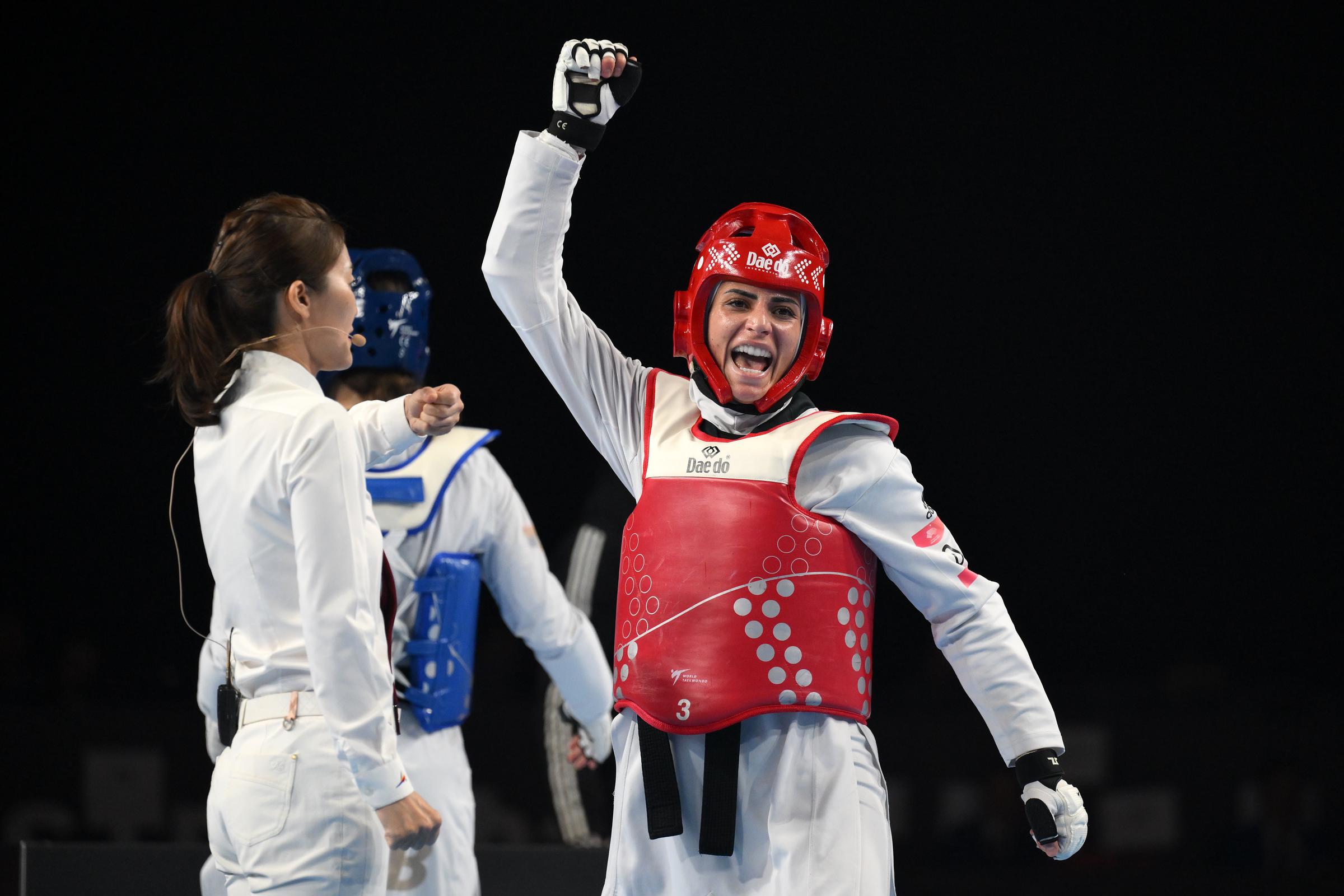 Julyana Al-Sadeq of Jordan celebrates her win in the final against Aleksandra Perisic (Blue) of Serbia in the Female -67kg category at Manchester Regional Arena on December 03, 2023 in Manchester, England | Source: Getty Images