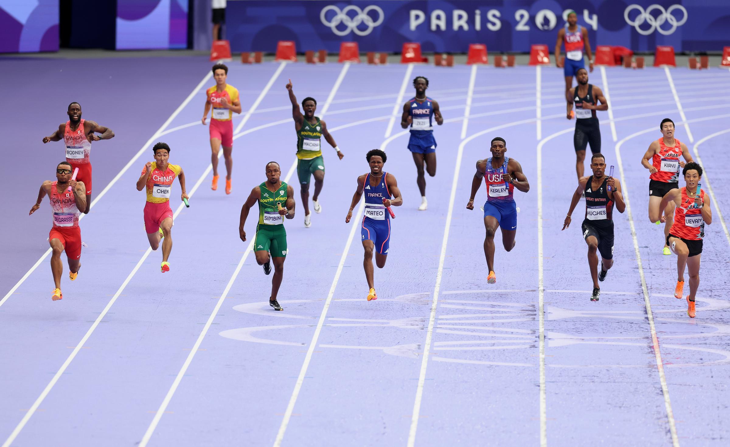 Fred Kerley and other athletes competing in the Men's 4x100-meter Final during the 2024 Summer Olympics on August 9, in France. | Source: Getty Images