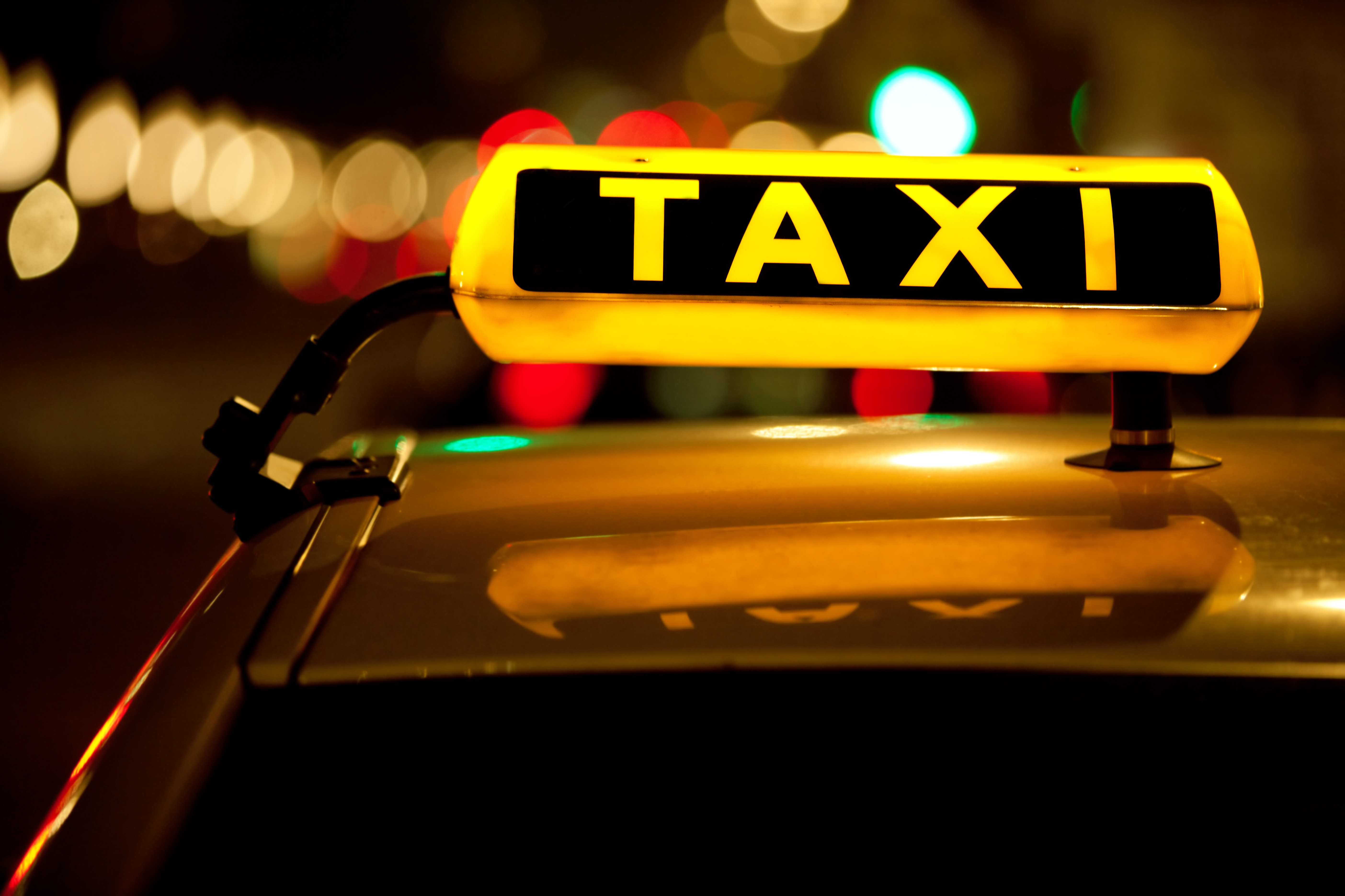 Taxi cab sign on top of the vehicle. | Source: Shutterstock
