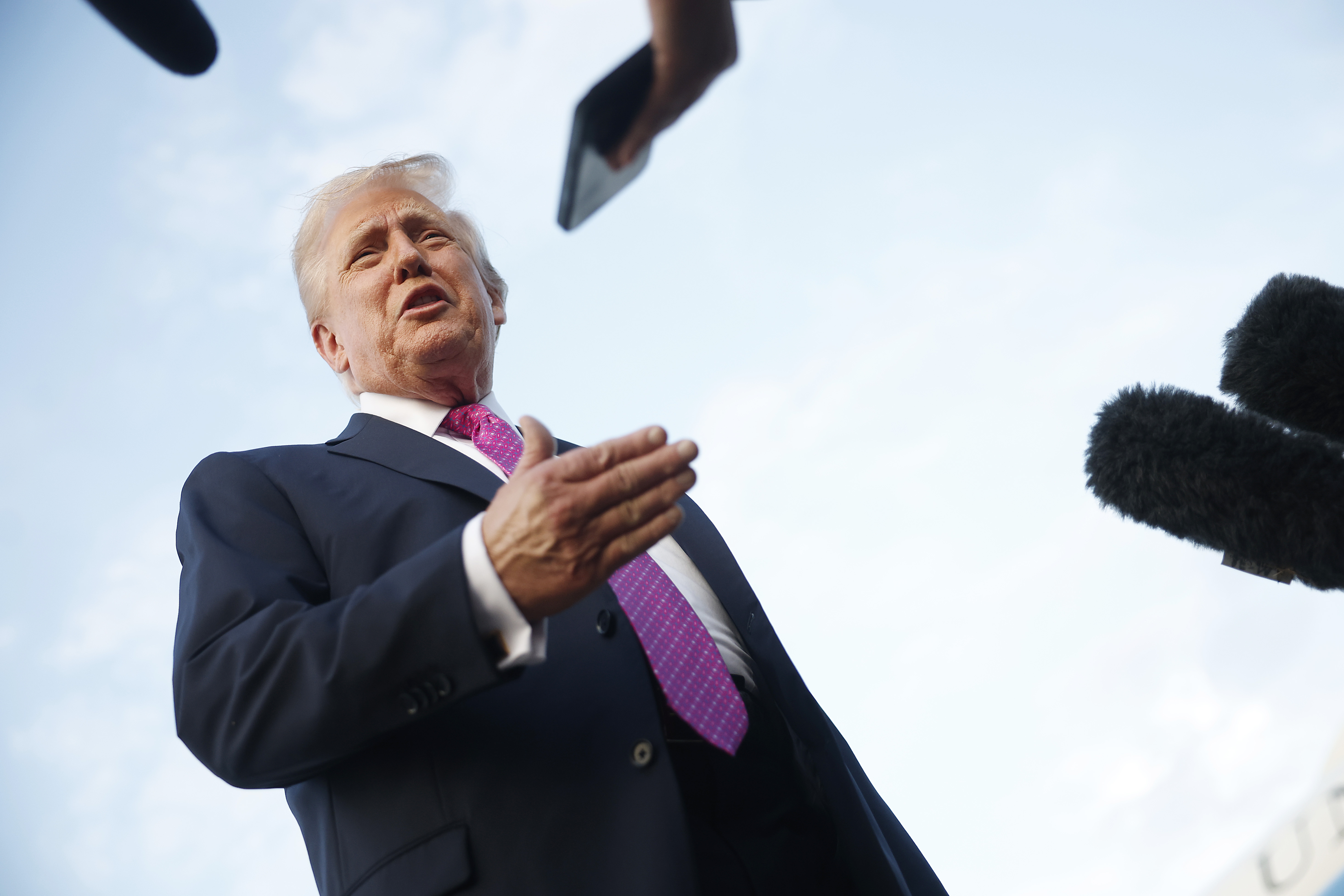 President Donald Trump speaks to reporters before boarding Air Force One at Morristown Airport, New Jersey on September 14, 2025 | Source: Getty Images