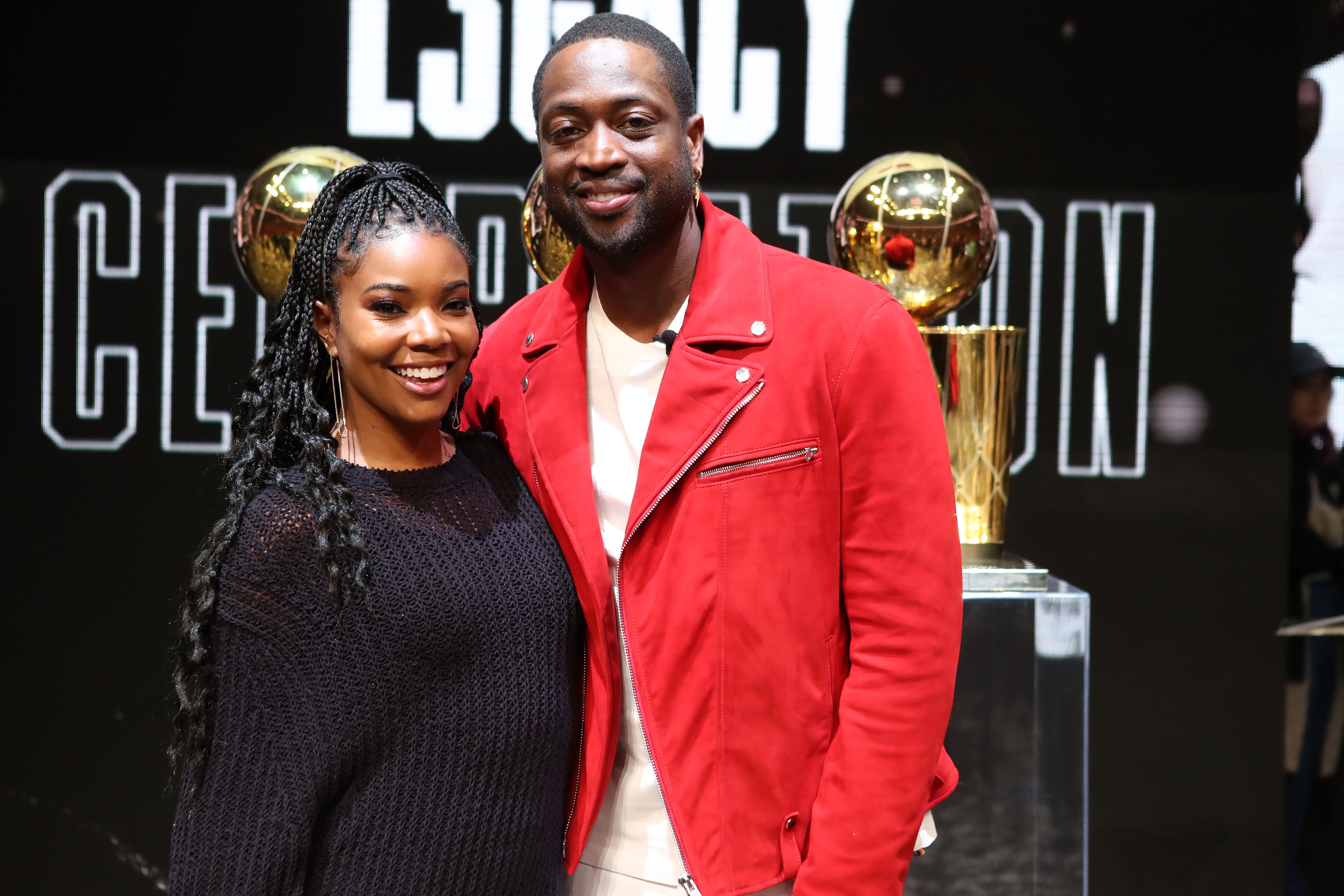 NBA Legend Dwyane Wade poses for a photo with his wife Gabrielle Union at the Jersey Retirement Flashback Event on February 21, 2020 | Photo: Getty Images