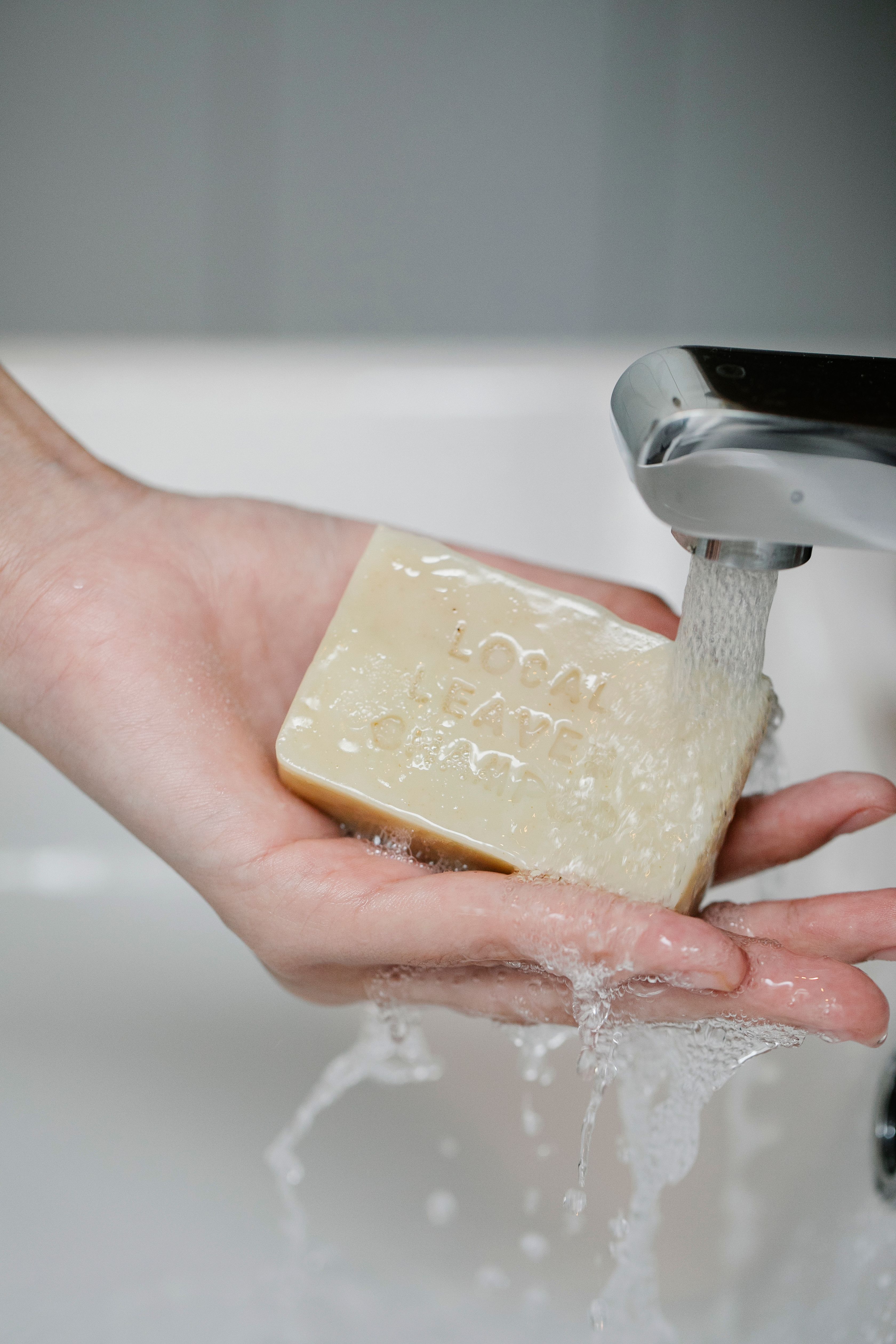 A person using a bar of soap for washing | Source: Pexels