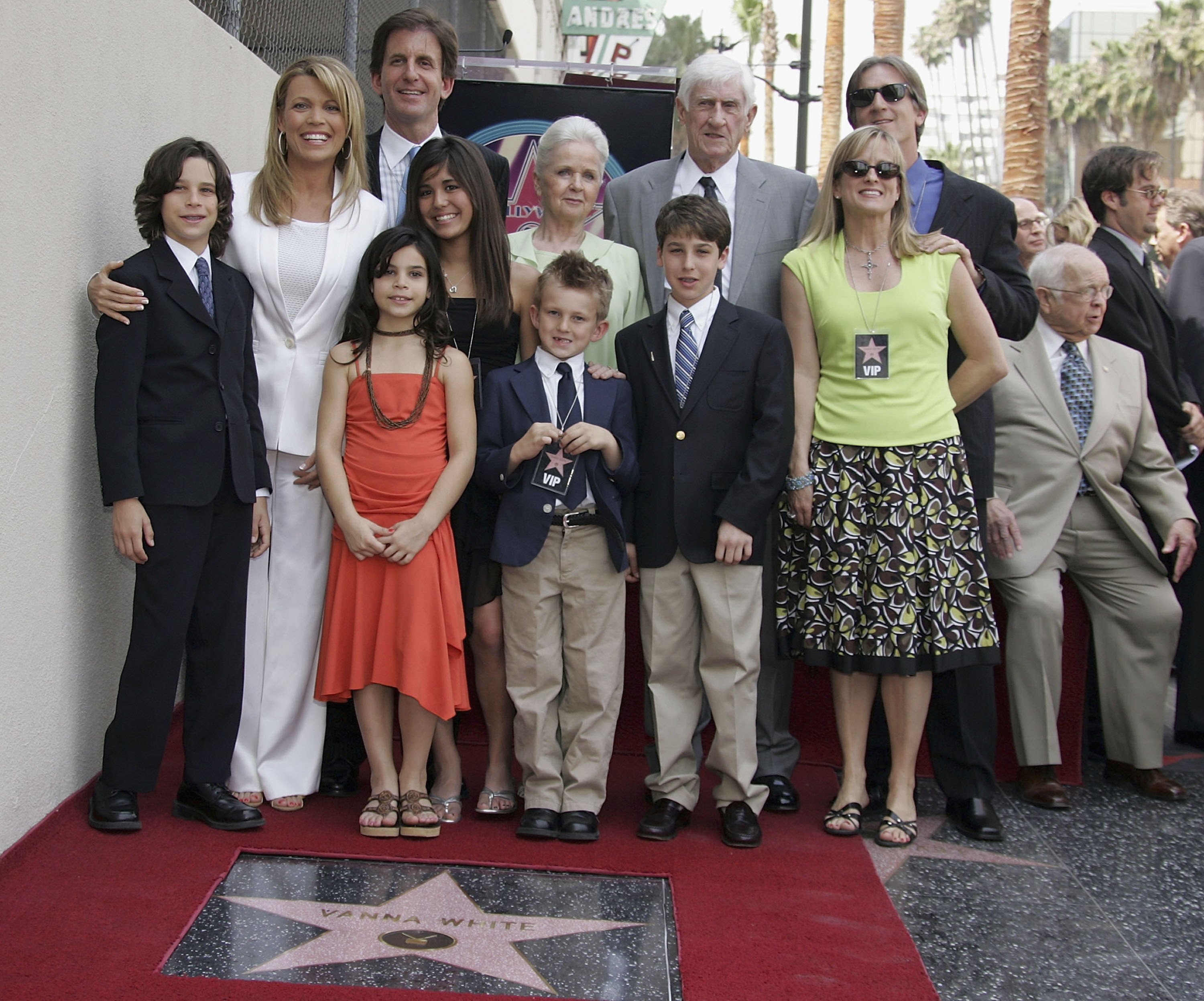 Wheel of Fortune Co-host Vanna White poses with family and friends after receiving A Star On The Walk Of Fame. | Source: Getty Images