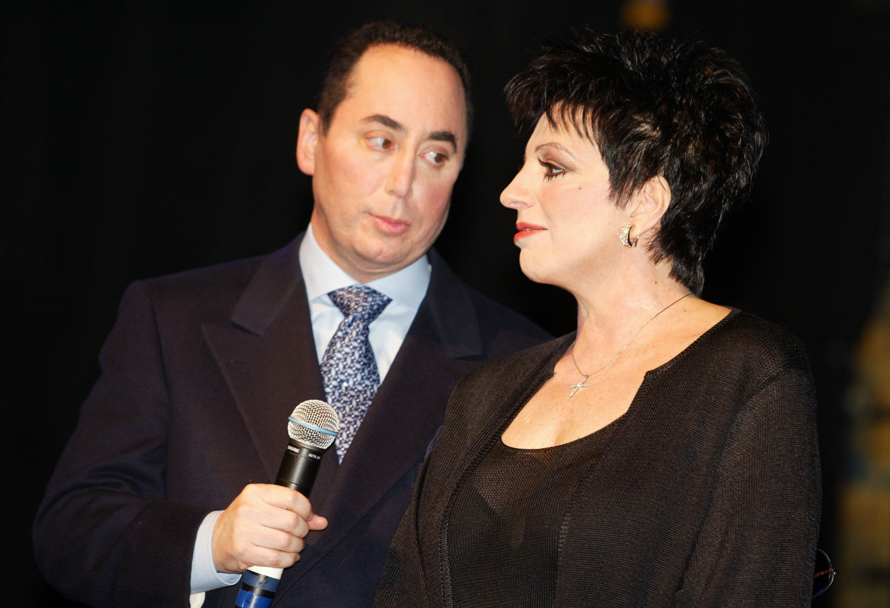 As the press conference continued, Gest turned his attention toward Minnelli while she looked back at him, capturing another moment between the couple only months after their lavish 2002 wedding. Their appearance came during the early months of a marriage that would prove brief, with the pair separating little more than a year after exchanging vows before their divorce was finalized in 2007.