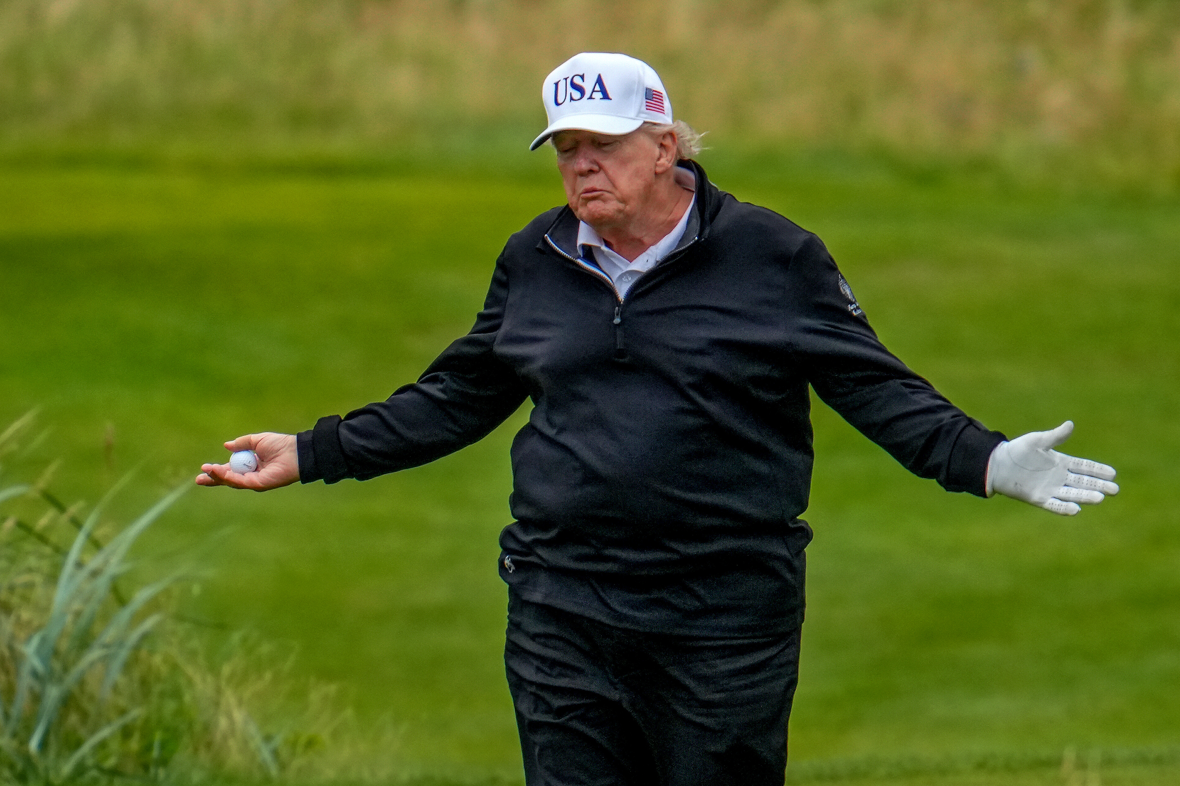 President Donald Trump reacts as he plays a round of golf at Trump Turnberry golf course during his visit to the UK in Turnberry, Scotland on July 27, 2025 | Source: Getty Images