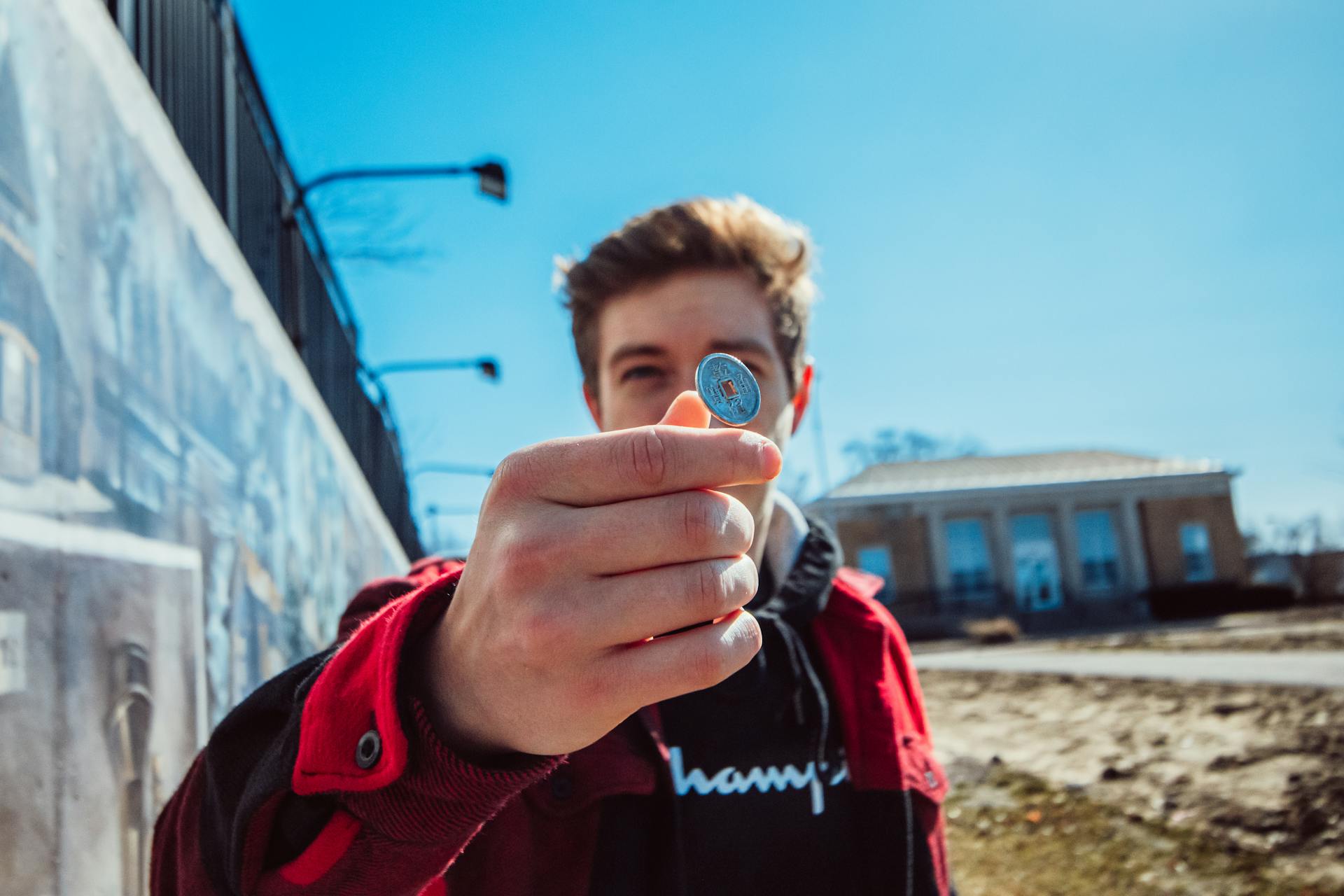 A young man flipping a coin | Source: Pexels