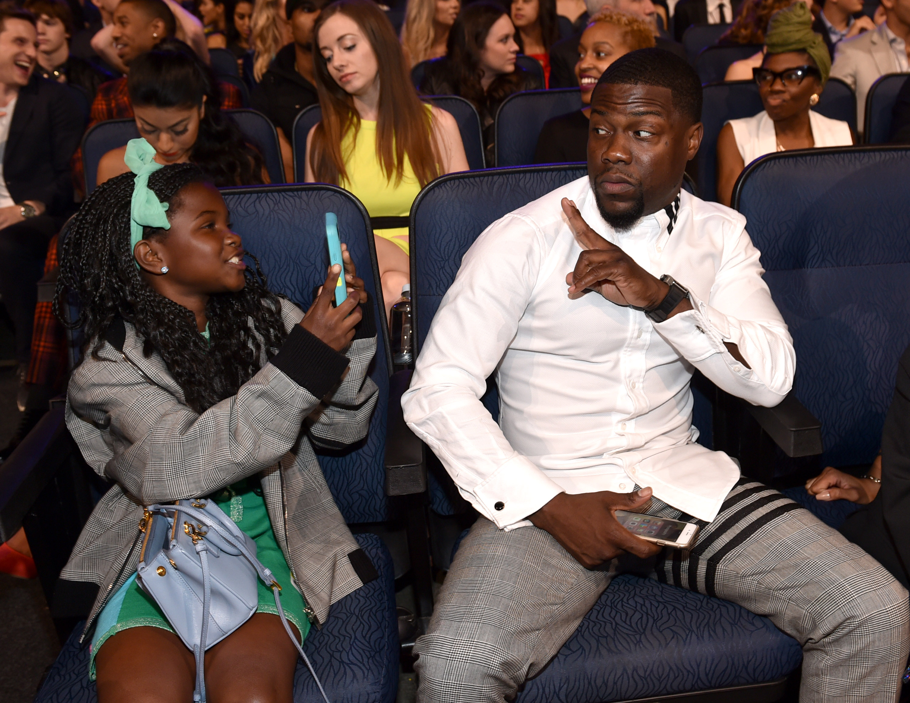 Kevin Hart and Heaven Hart sat at The 2015 MTV Movie Awards at Nokia Theatre L.A. Live in Los Angeles, California, on April 12, 2015. | Source: Getty Images