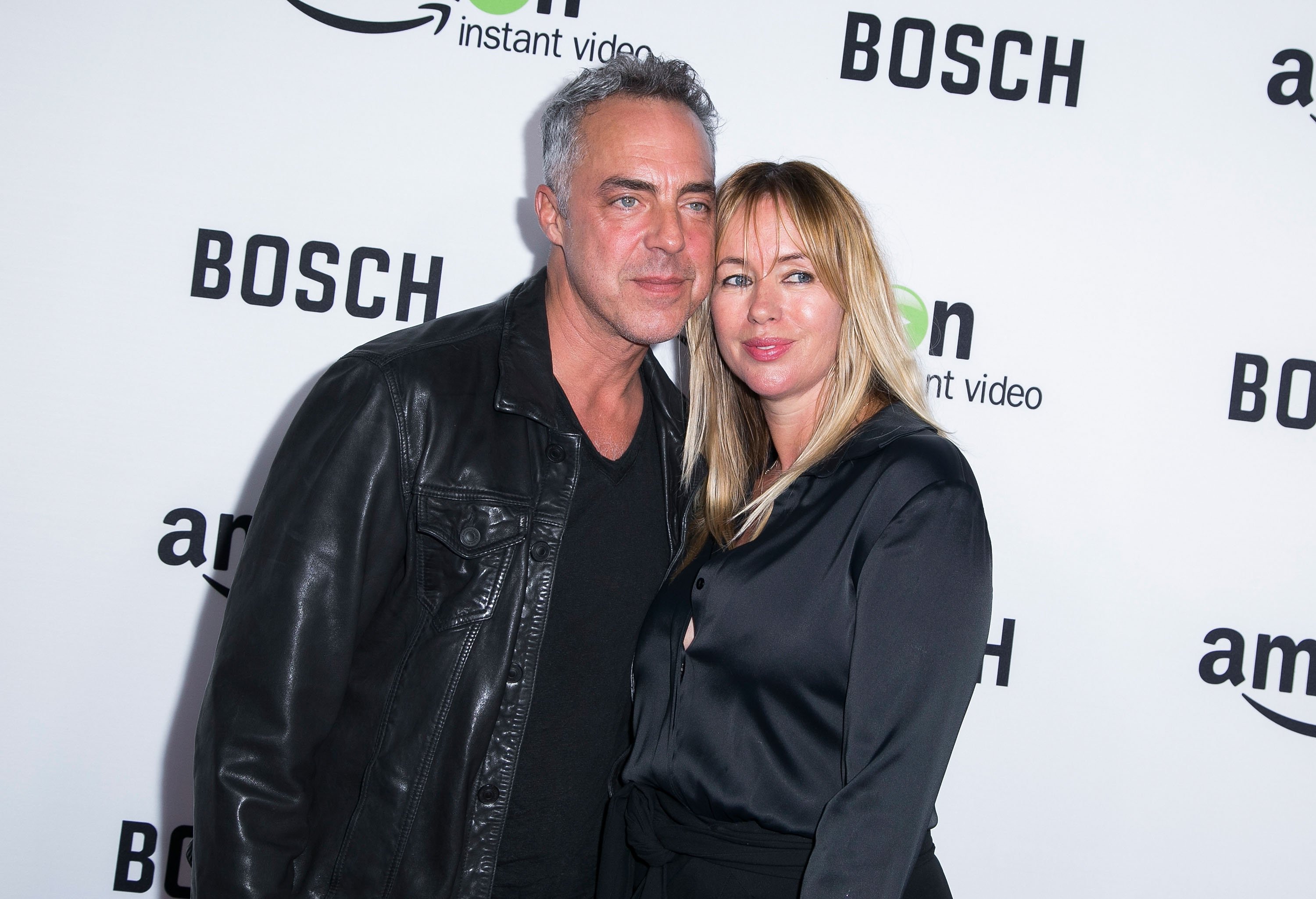 Actor Titus Welliver (L) and wife Jose Welliver attend the "Bosch" premiere screening at The Dome at Arclight Hollywood on February 3, 2015, in Hollywood, California. | Source: Getty Images