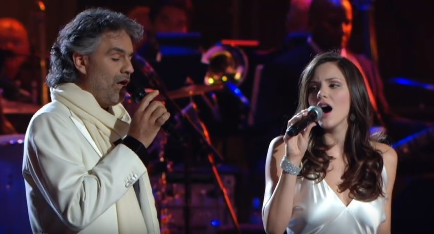 Katharine McPhee watches Andrea Bocelli as the duo belt out emotional lyrics of the song “The Prayer.” | Source: YouTube/HDGoodMusic
