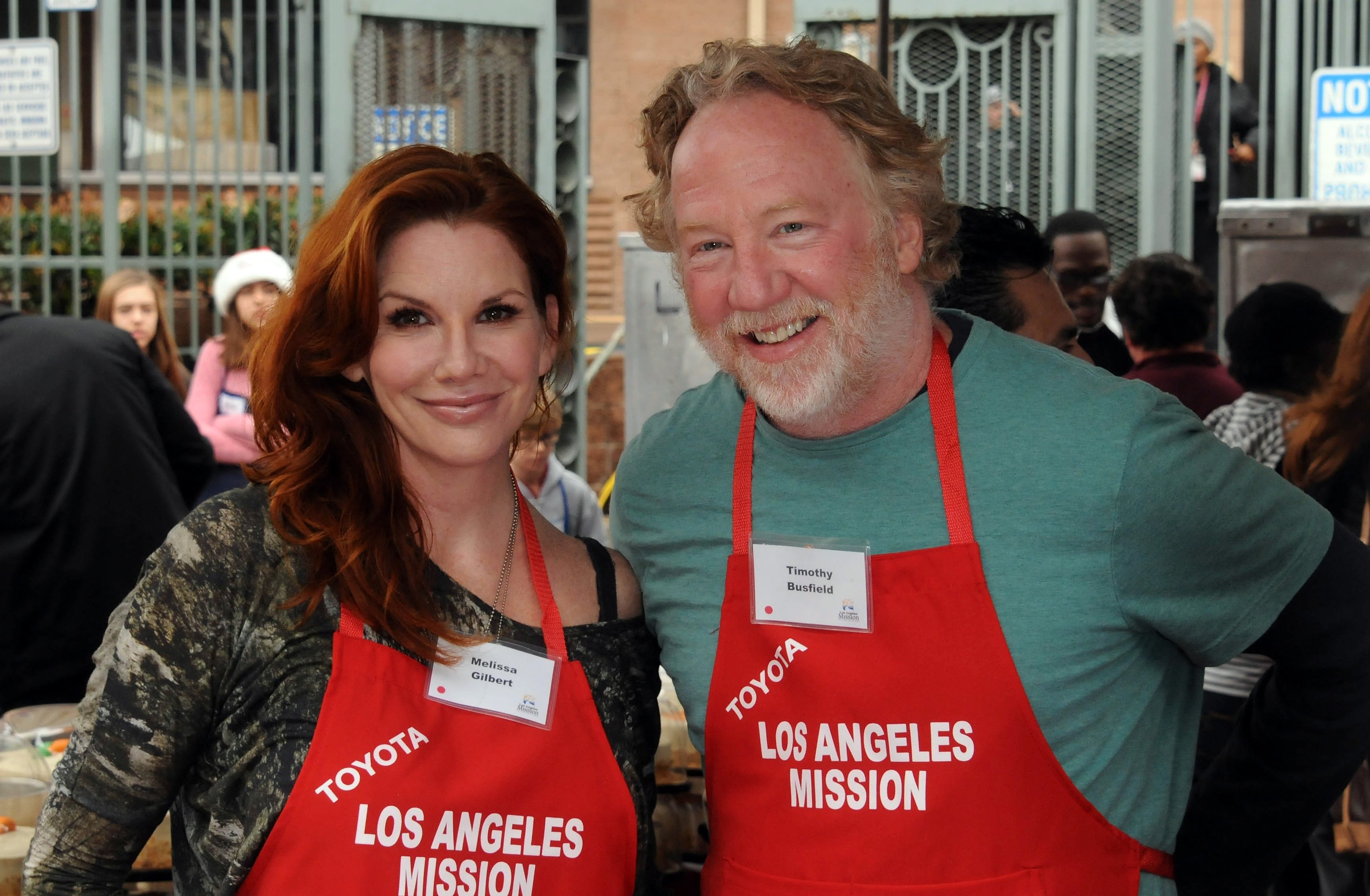 Actress Melissa Gilbert and actor Timothy Busfield participate in the Los Angeles Mission Christmas Eve lunch For The Homeless held at the Los Angeles Mission on December 24, 2012 in Los Angeles, California | Source: Getty Images