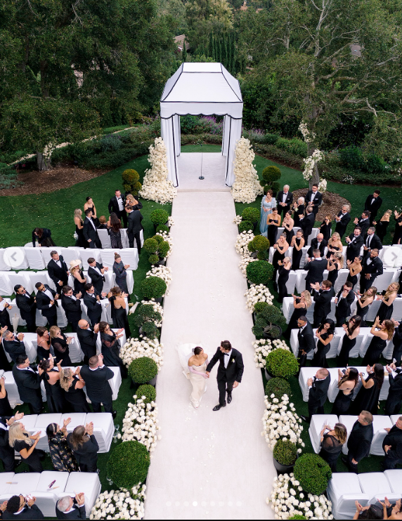 Josh Allen and Hailee Steinfeld walk down the aisle after exchanging vows in an outdoor ceremony in California, posted in June 2025 | Source: Instagram.com/josevilla