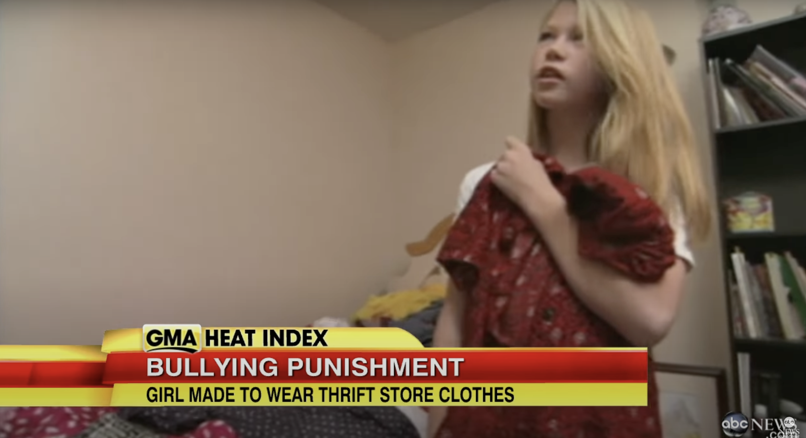 Kaylee holding one of the thrift store dresses her stepmom bought her, from a video dated May 23, 2013 | Source: youtube.com/ABCNews