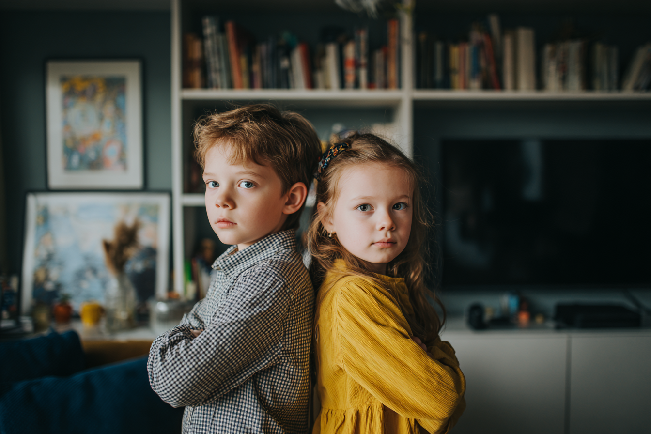 Two kids standing together | Source: Midjourney