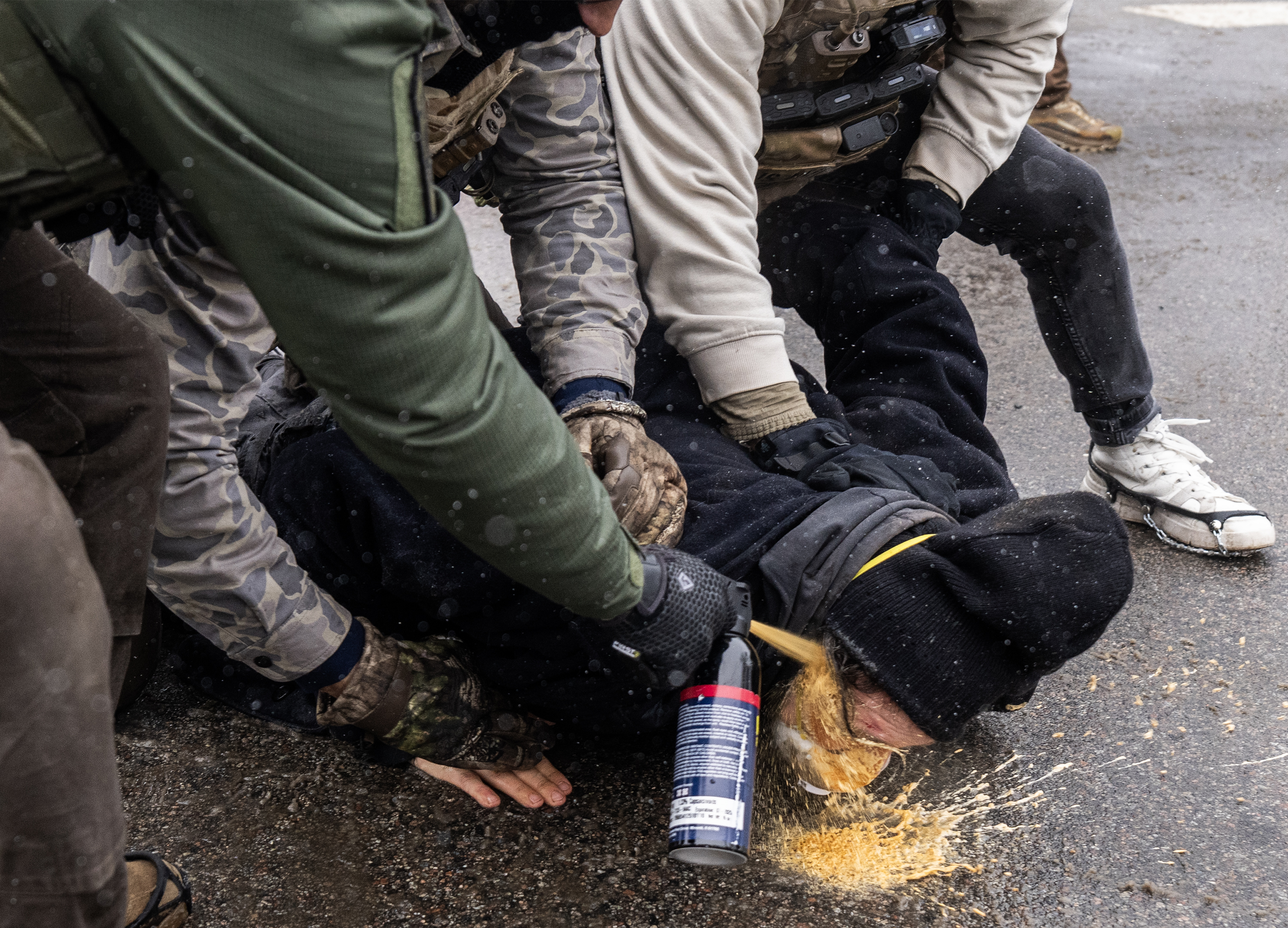 Federal law enforcement agents confront anti-ICE protesters during a demonstration in Minneapolis, Minnesota, on January 15, 2026 | Source: Getty Images