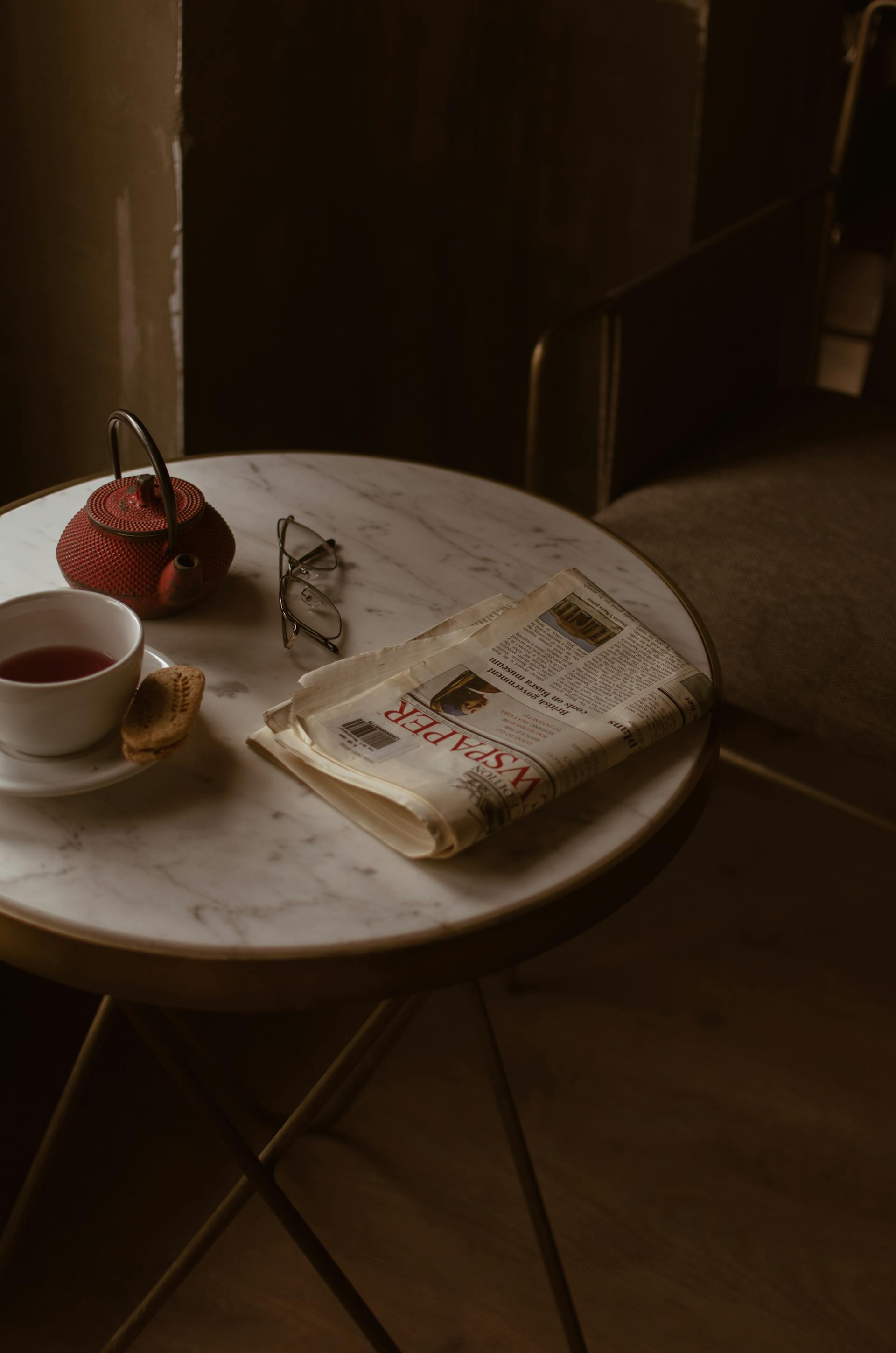 A folded newspaper lying on a table | Source: Pexels