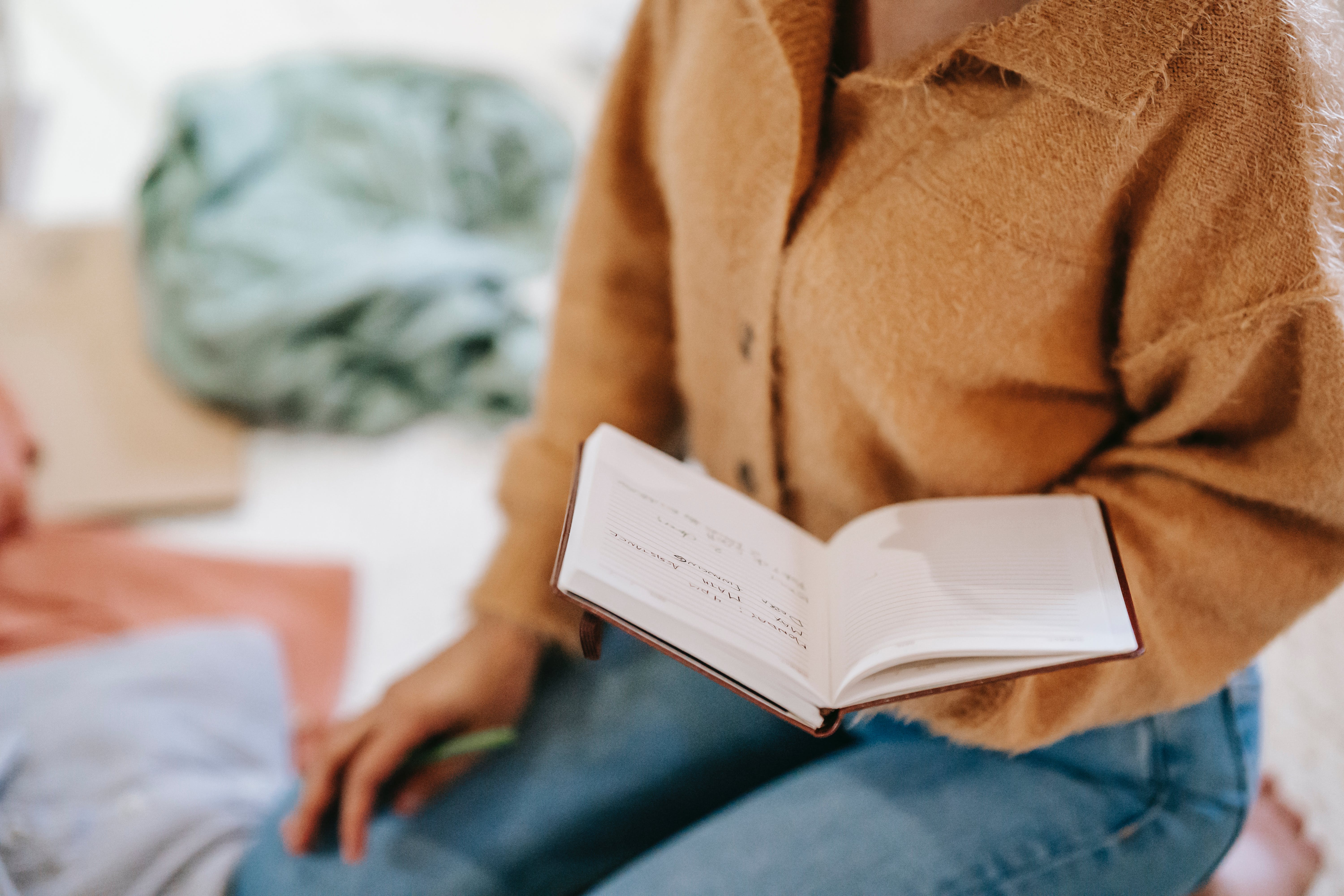 A woman reading through a book | Source: Pexels