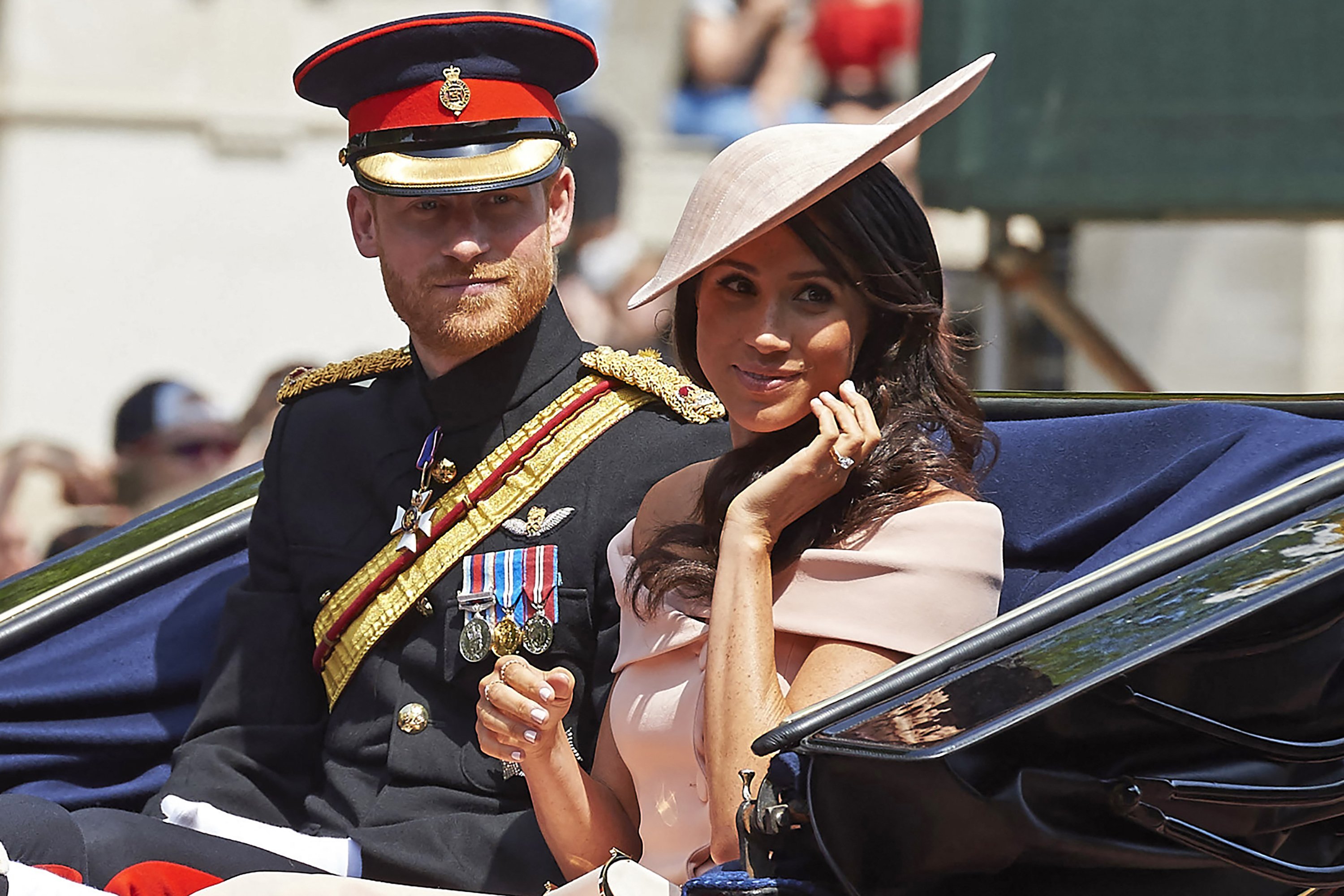 Prince Harry and Duchess Meghan return in a horse-drawn carriage after attending the Queen's Birthday Parade, "Trooping the Colour," in London on June 9, 2018 | Source: Getty Images