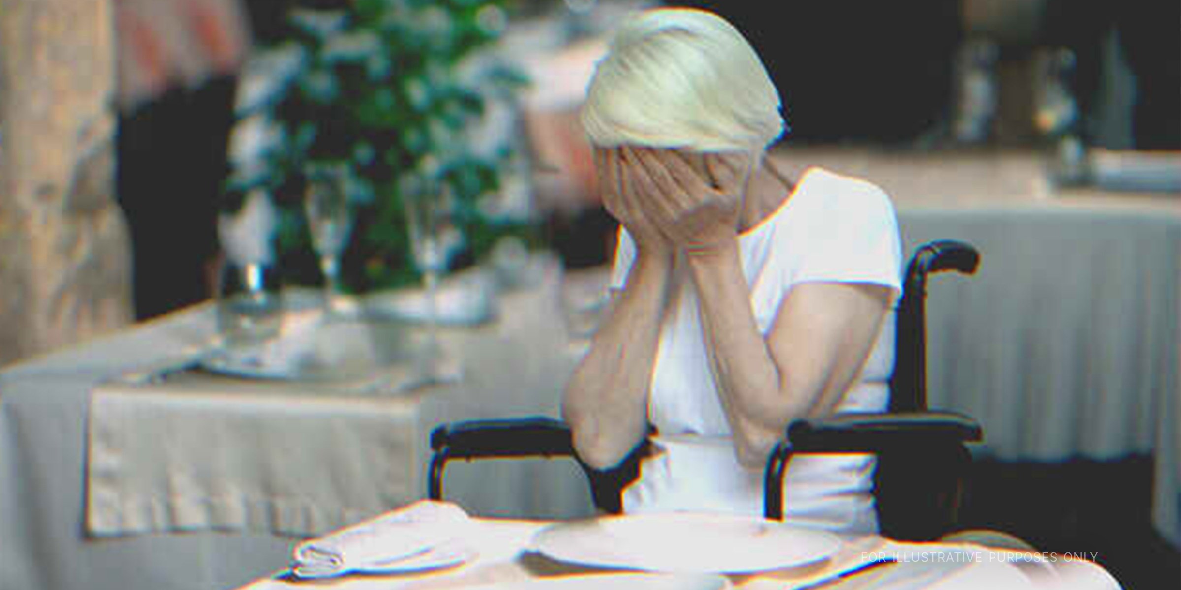Old woman in a wheelchair crying at a restaurant. | Source: Shutterstock