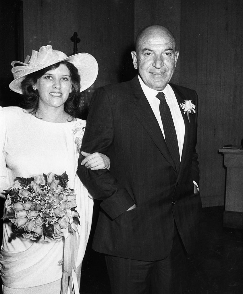Telly Savalas and Julie Savalas on their wedding day on March 8, 1986, at St. Sophia Church in Los Angeles | Photo: Getty Images
