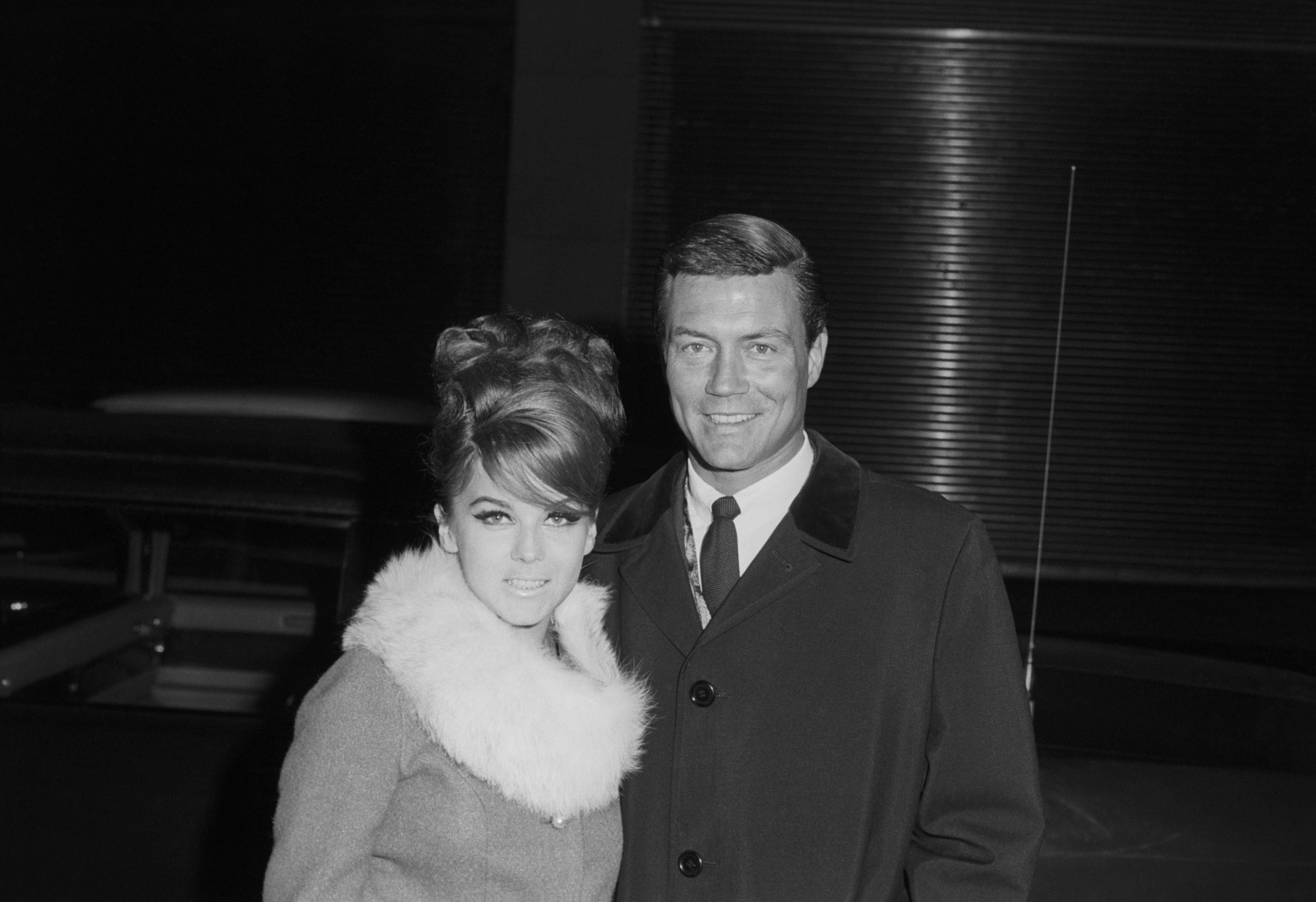 Roger Smith in a black coat with Ann-Margret in a fur collar coat pictured in 1970 in New York. | Source: Getty Images