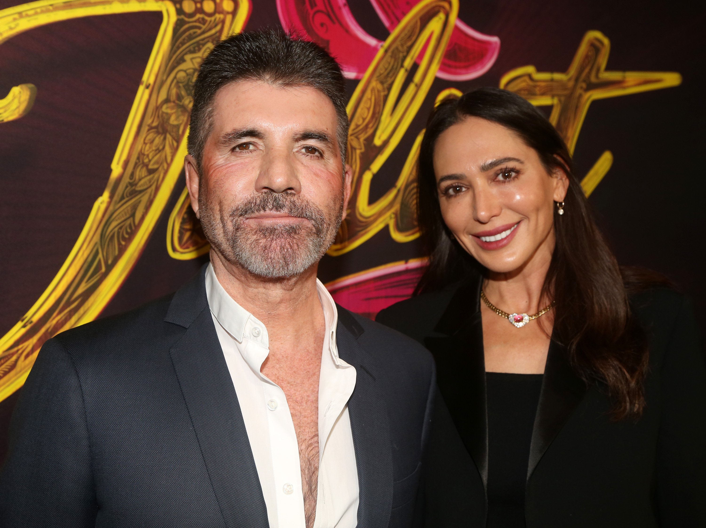 Simon Cowell and Lauren Silverman pose at the opening night of "& Juliet" on Broadway on November 17, 2022 in New York City | Source: Getty Images